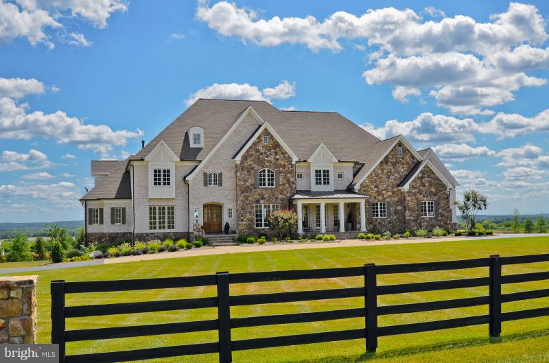 Priced $1 Million BELOW construction cost! Great Potential Horse Property or Vineyard Spectacular Stone&Brick French Country Estate on 15 acres just 5 mins from Historic Downtown Leesburg. This masterpiece boasts unparalleled finishes and olde world craftsmanship throughout.  Approximately 13,000 square feet Main Home and 1000s/f Separate Guest Home w/2 car Garage.