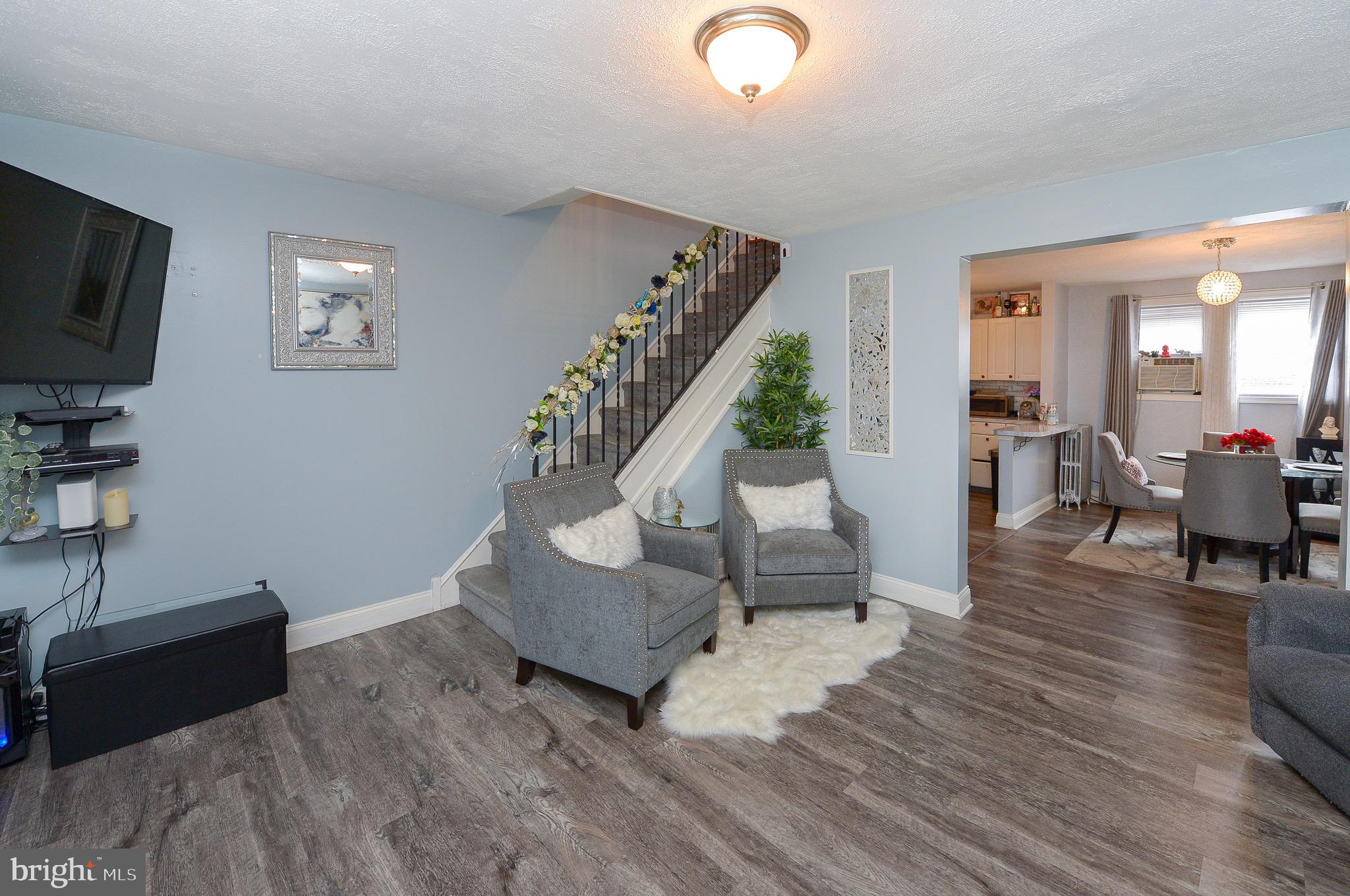 Welcome to this beautiful 3 bed 2 bath Elmwood Park home.  Look no further! The first level offers wood flooring , open dining room connected to an updated kitchen with white oak cabinets.  The second level provide 3 ample sized bedroom's , with a 3 piece hall bath.  This home boast great entertaining space for guest with a stone patio below the front porch.  It is renovated with a full finished basement and added half bath. This home is move in ready for any new buyer! Do not miss out.