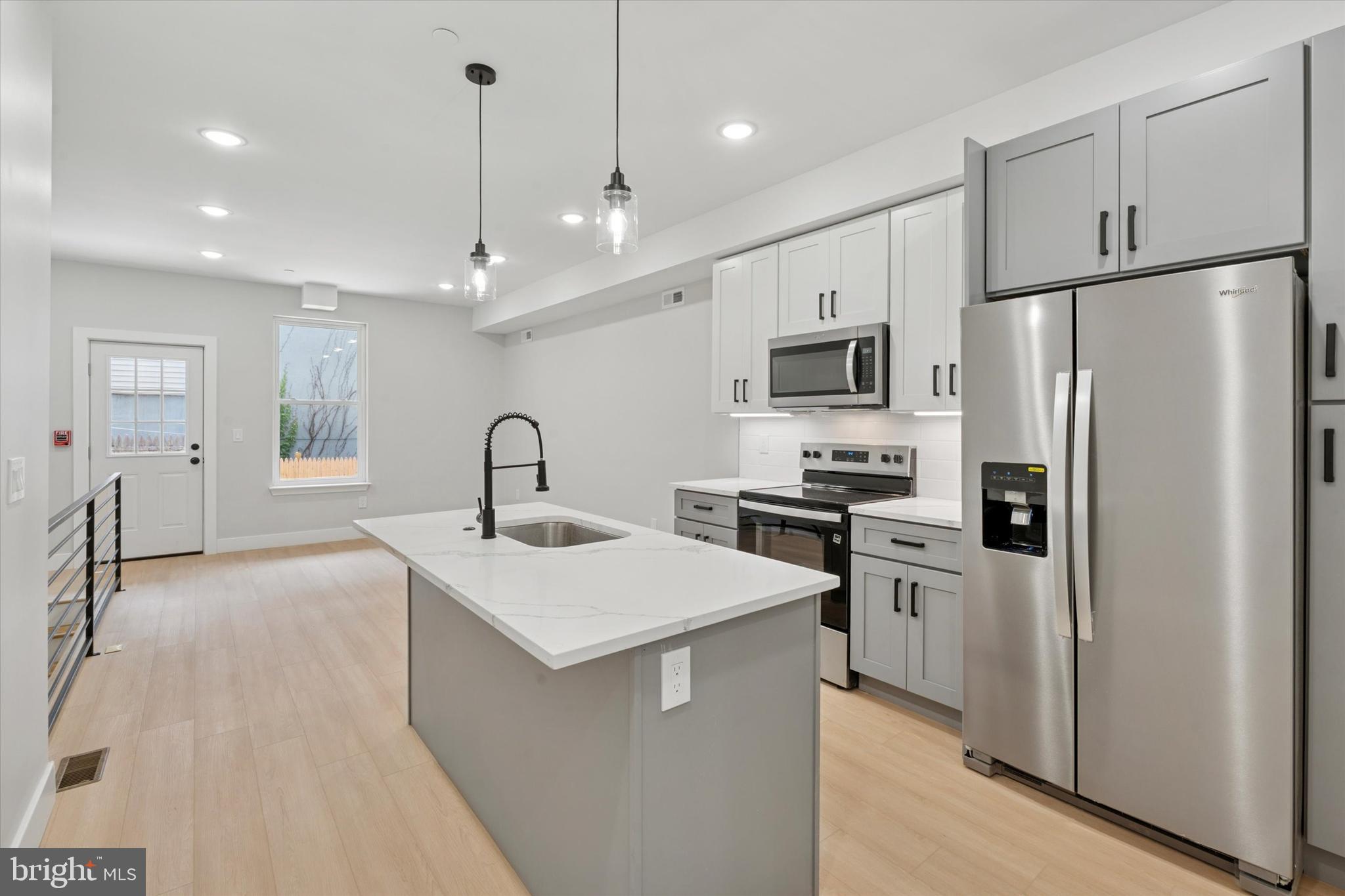 New Construction 5 unit apartment building in hot Norris Square area with 10 year tax abatement. CURRENTLY LEASED at $8,900/month with an efficient unit mix and located in a QOZ (qualified opportunity zone) for maximum tax benefits. All units have private outdoor spaces with decks, roof decks, and patios. Large comfortable layouts with modern finishes and great natural lighting. High quality materials like TPO roofing, full red brick front, Pella windows, custom metal railings, large entry lobby. 5 Unit Mix: (2) - 3bd /3ba bilevel,  (2) - 2bd/2ba bilevel,  (1) - 2bd/1.5bath.