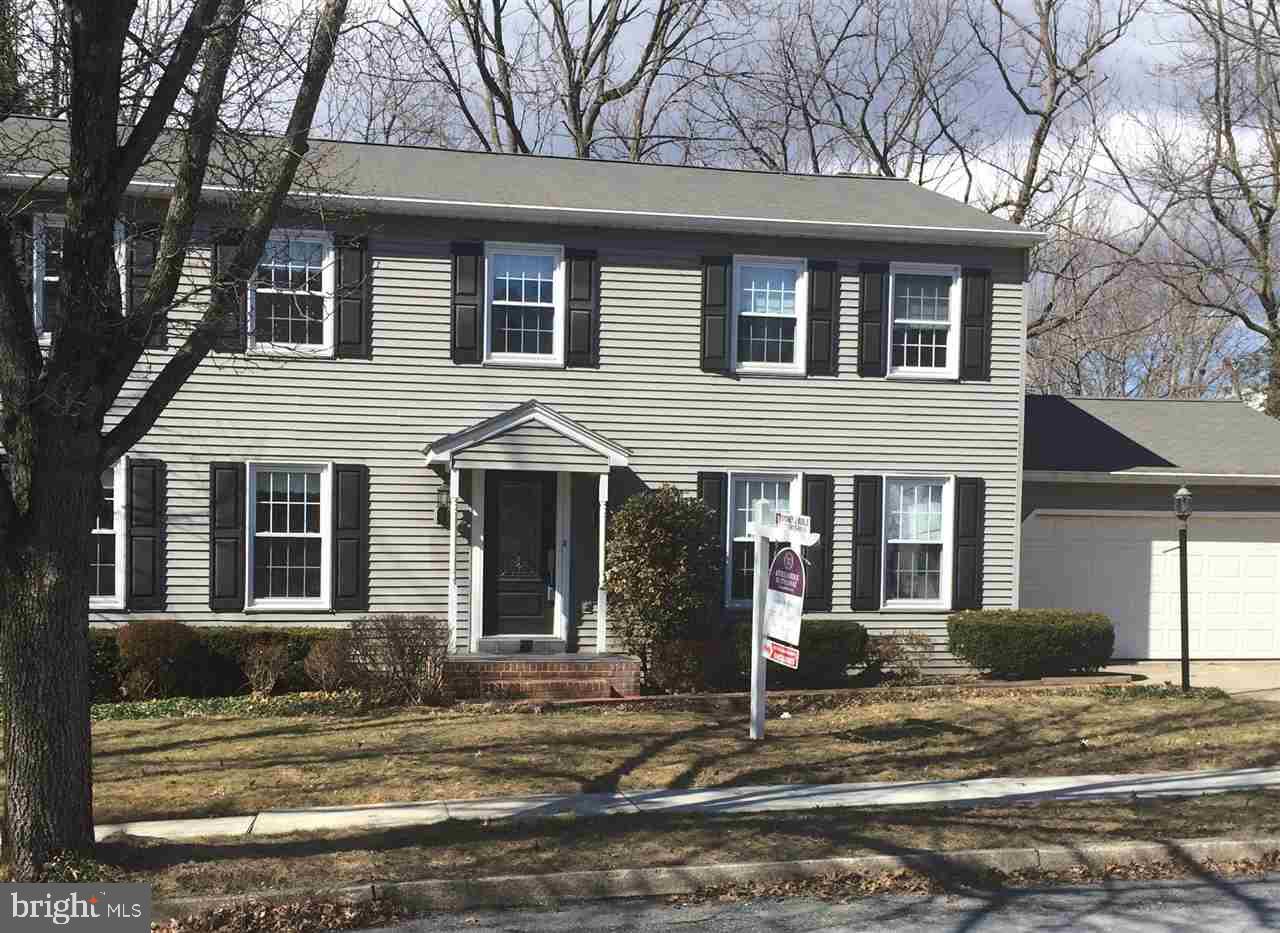 Lovely Traditional two story with formal living room & dining room. Totally remodeled Kit w/cherry cabinets, solid surface countertops, & pantry. Family room features a brick fireplace w/gas logs. Very large Master suite with walk-in closet. Partially finished basement with lau room. Inviting sunroom & large deck overlooking a beautiful treed yard. Easy access to major highways and convenient to shopping opportunities.