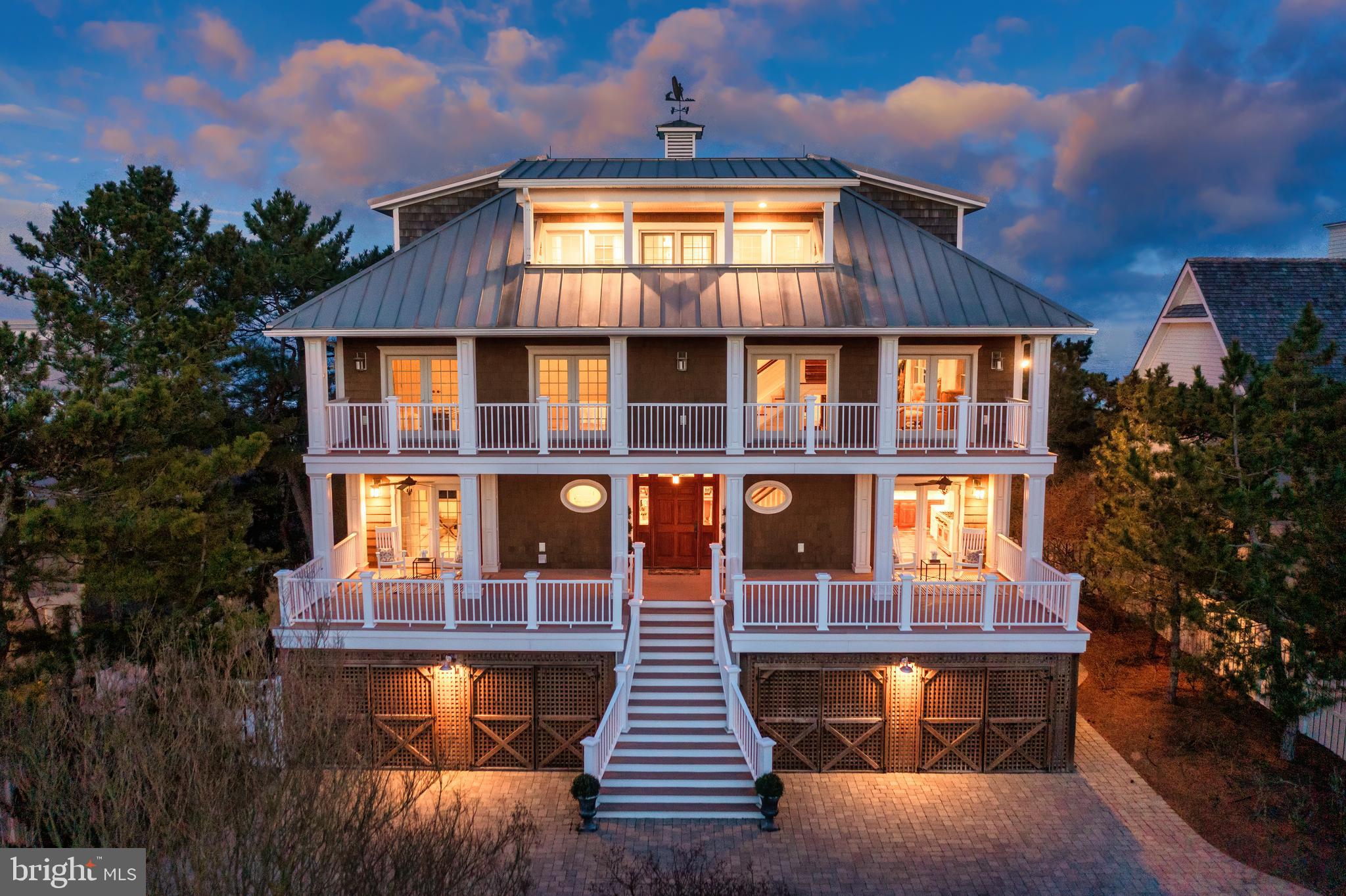Welcome to 4 Ocean Drive, an oceanfront masterpiece situated in the prestigious community of North Shores. This Rehoboth Beach oasis boasts incredible panoramic ocean views at every turn, expansive decks on each level and access to a tranquil private beach. The epitome of luxury, this sprawling home offers 10 bedrooms and 8 full baths spread over 4 levels with elevator access to each.  This home could not be duplicated with current building code. The main floor features reclaimed hardwood floors, gourmet kitchen with Carrara marble countertops and backsplash, stainless steel appliances, eight burner range with dual oven, wine fridge, and 12-foot breakfast bar, dining area with seating for 10, spacious living room, guest bedroom with en-suite bath, flex room and laundry. Step upstairs to find the ideal space for all your guests. This level offers another expansive living room, which is adorned by a gas fireplace, magnificent custom built-ins, beverage fridge, hardwood floors, additional sitting area, Jack and Jill suite, plus an additional guest bedroom and full bath. The uppermost level is the perfect space for the owners to retreat and unwind. Two master suites each offer breath-taking views of the Atlantic Ocean, private decks to take in the ocean breeze, and spa-like master baths with soaking jacuzzi tubs and showers. The master suites are flanked by a light filled and open sitting room with wet bar and custom-built ins. The ground level includes a den, flex space, 2 guest bedrooms, 2 full baths and additional laundry room. You will never run out of ways to be entertained in North Shores since this amenity rich community includes access to the Gordon’s Pond Trail, community pool, marina and tennis courts while located only minutes to Rehoboth Avenue which is lined with a magnitude of restaurants and shops. Excellent opportunity and this elegant property is ready to become your summer retreat!