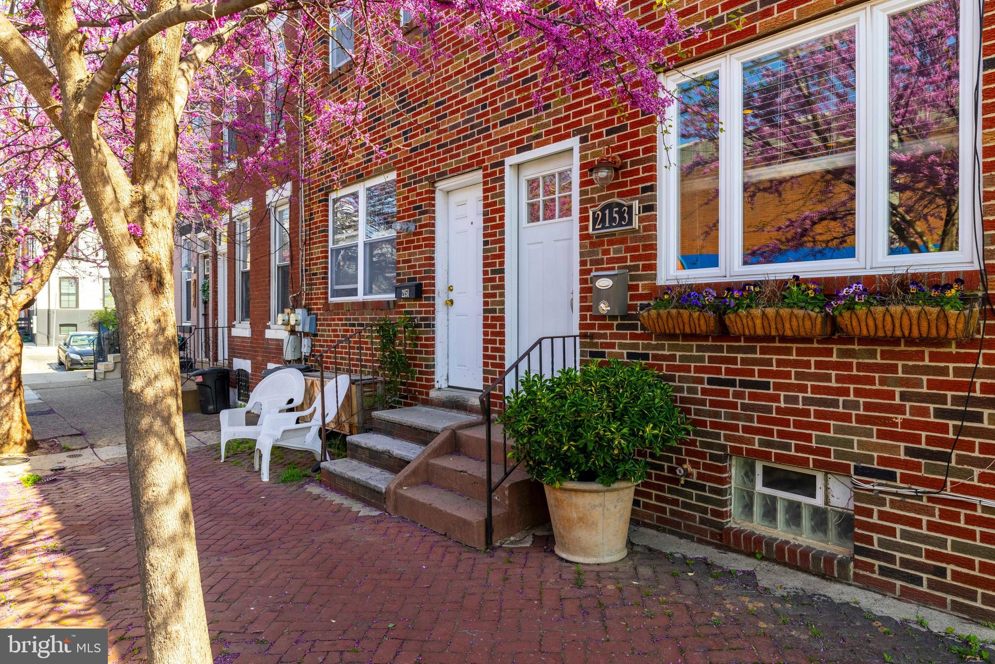 Welcome to 2153 E Hagert Street!  This 2 bed / 1.5 bath charmer with AC has been beautifully maintained and is perfectly sized for easy living in close proximity to everything that Fishtown has to offer. Walk up past the window boxes and Eastern redbud tree to the front door and enter through the foyer, which serves as a welcome buffer from the elements. You’ll immediately notice that this home is full of light as a result of the thoughtfully designed window placement including the large picture window in the front, as well as recessed lighting. The 4 inch hardwood floors you see in the open concept living room / dining room also continue throughout both floors. The bright and sunny kitchen features custom cabinets with dovetail drawers and easy close gliders, GE stainless steel appliances including a gas range, sleek granite countertops, and a tiled floor for easy clean-up. Through the kitchen’s sliding glass doors, you access the outdoor living space perfect for indoor-outdoor entertaining year round. The first floor is completed by a coveted first floor powder room. The second floor has two spacious bedrooms, both with ceiling fans for air circulation and abundant closet space.  The oversized full bathroom includes a combination tub and shower as well as a large custom vanity. The dry, full height basement is where you’ll find the laundry center and plenty of room for storage. Because of its proximity to the Horatio B. Hackett elementary school, street parking is easy to find on weekdays and even easier in the summertime. Walkability is key in Fishtown and you are steps from Vessel Coffee Collective, Philadelphia Brewing Company, Circles and Squares, Fiore, and Meetinghouse.A few minutes more and dinner at Suraya, LMNO, or Kalaya or a drink at Johnny Brenda’s can become a regular occurrence.  Nestled in the heart of a vibrant neighborhood, with easy access to public transit, this location is perfect for those who want to immerse themselves in the city.