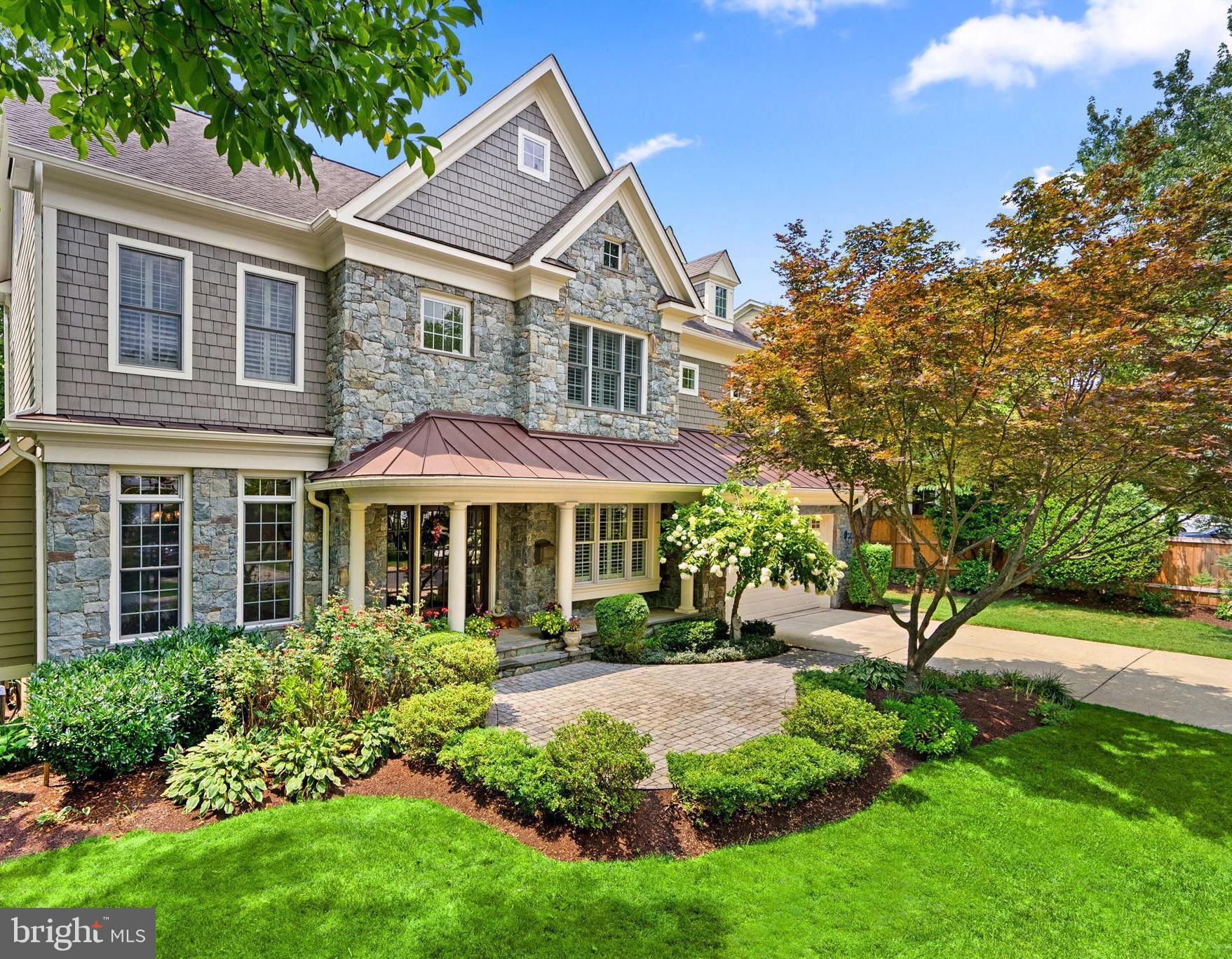 Whitman cluster! Custom built 6 bedroom, 6.5 bath masterpiece in a prime location. Walk to downtown Bethesda, 3 blocks to Bradley Hills Elementary, public transportation, parks, Suburban Hospital and NIH.  GORGEOUS, quiet tree-lined street, with very little traffic. Four (4!) levels of blissful living, built with only the finest finishes. Sundrenched and immaculate, it looks like a brand new home! Natural fieldstone graces the front elevation and rear of the property. Zen-like backyard oasis with expansive $100K+ multi-level stone patio, mature landscaping, massive decorative stones, and mood lighting is private, and perfect for entertaining! For the discerning buyer: 3 fireplaces (living room, family room, and Zen-like owner's retreat). Highly functional floor plan with a fourth level, bright triple windows, ideal for overnight guests or college students. Gleaming hardwood floors on main and bedroom level and ALL bedrooms are ensuite. Owners retreat has a recessed arched entry, custom molding, tray ceiling, breakfast/coffee bar with a beverage fridge, walk-in custom built closets (2) and a sanctuary spa-like bathroom with a walk-in shower, separate double vanities and a soaking tub. Welcoming front porch with a fabulous glass front door allows lots of natural light. First floor home office, light filled living room, banquet sized dining room with bay window, fully equipped top-of-the line gourmet kitchen and breakfast room. Gleaming quartz counters, breakfast bar, and quartz backsplash, professional range, Sub Zero refrigerator, the works! Family room has coffered ceilings, beautiful millwork, stone fireplace and a walk-in bay window. Mudroom has two convenient entrances and the oversized two-car garage is pristine with epoxy floors and finished painted walls. Best basement in Bethesda: light filled with French patio doors, full size windows, walkout to fieldstone patio, gym/media room, guest suite, full bathroom, storage room and a vast recreation/activity space large enough for seating, table-tennis table and all your favorite things. Don't miss this Bradley Hills gem. Call me to set a time to see your next home!