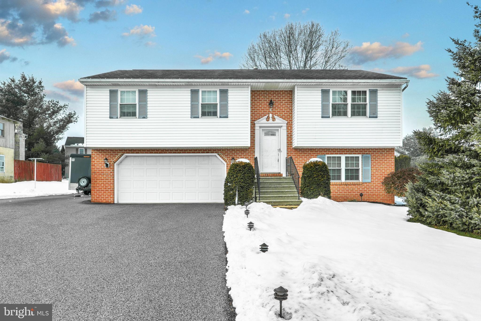 Beautifully Maintained One Owner, Split Foyer in Red Lion Schools! This 3 bed 2 full bath home is sure to please.  Walk in the Foyer and you are met with all new Luxury Vinyl Plank waterproof flooring throughout the main living area. The large living room opens up to the kitchen and spacious dining area.   The newly updated kitchen features mosaic tile backsplash and quartz countertops. Updated bathrooms include new vanities and ceramic tile floors. The primary bedroom is complete with 2 large closets and and an ensuite full bathroom.  First level has an oversized 2 car garage with an additional storage closet. The family room is the entire width of the house and could be used as 2 separate spaces one for a home office or home gym. Continue on outside, the clear level yard features an above ground pool with vinyl privacy fence around the pool deck. The walk out deck from the dining room is all composite deck material and vinyl railings. Outdoor features also include storage shed and large parking area for an RV, Boat, or Trailer. Updated and neat as a pin, all you'll need to do is Move Right In!