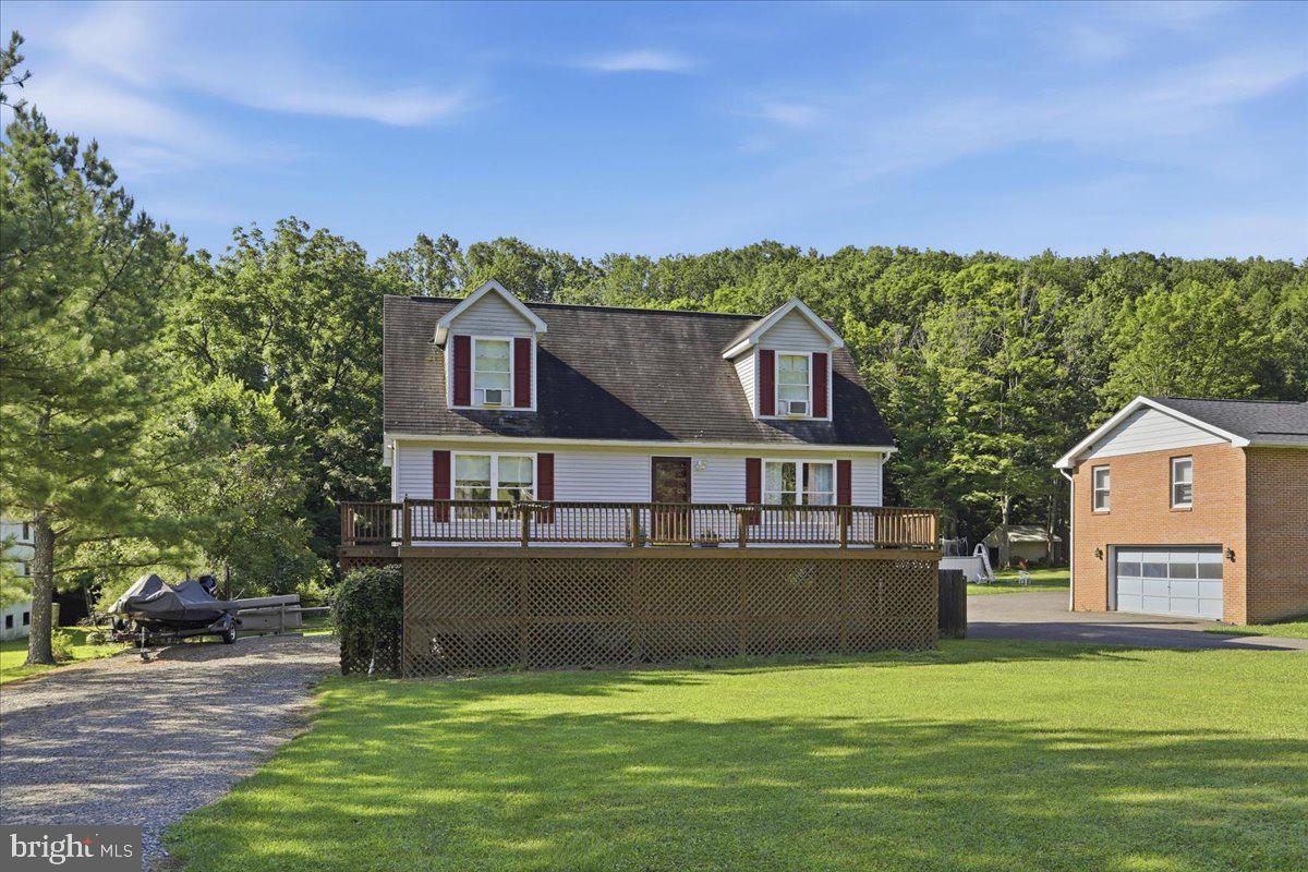 Tucked against the woods, this charming 3-bedroom, 1-bath Cape Cod nestled on a large, level lot on Gramlich Road is completely move-in ready and priced to sell. Just outside of city limits, this charming home offers the perfect blend of privacy and convenience, just minutes from shopping, dining, and everyday amenities. 

Inside, you'll find a cozy eat-in kitchen, a convenient main-level bedroom, a full bath, and a comfortable layout that's perfect for first-time buyers, those looking to downsize, or anyone seeking peaceful living. The full walkout basement provides plenty of storage or the opportunity for additional living space. 

Enjoy your morning coffee on the front deck or unwind on the rear deck while taking in the quiet, wooded backdrop. As an added bonus, it is soon to have a brand new roof!

If you've been searching for a home that's cozy, move-in ready, and offers a quiet setting without sacrificing convenience, this one is a must-see!