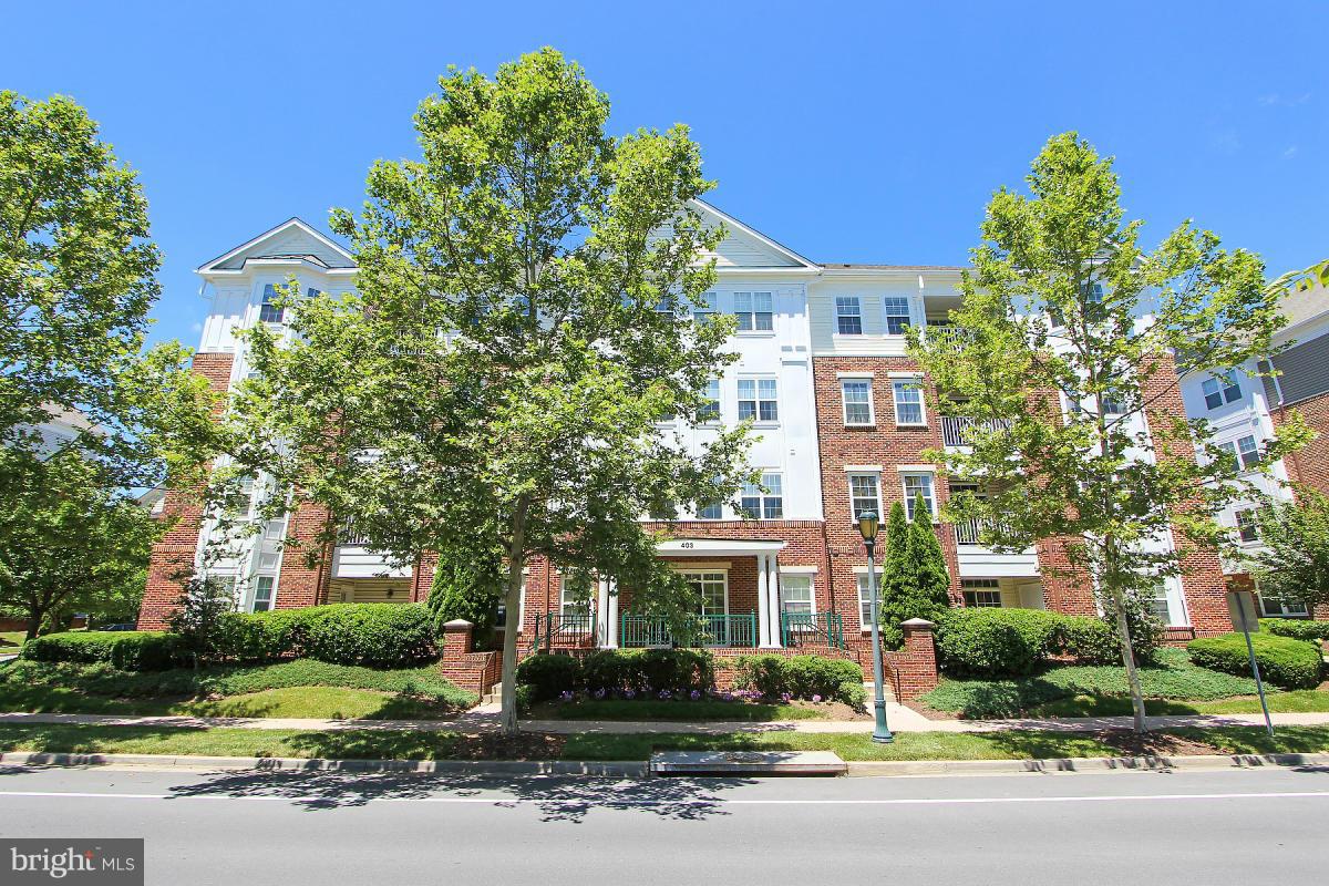 One of the largest units with over 2,100 sq. feet of living space. Features include dramatic  eat-in kitchen with center island and cathedral ceiling. Master suite with multiple closets including two walk-ins. Second bedroom with it's own full bath. Living room with tray ceiling. Den/library prewired for overhead light. One car attached garage(F). Across from shopping. Use of 2 outdoor pools