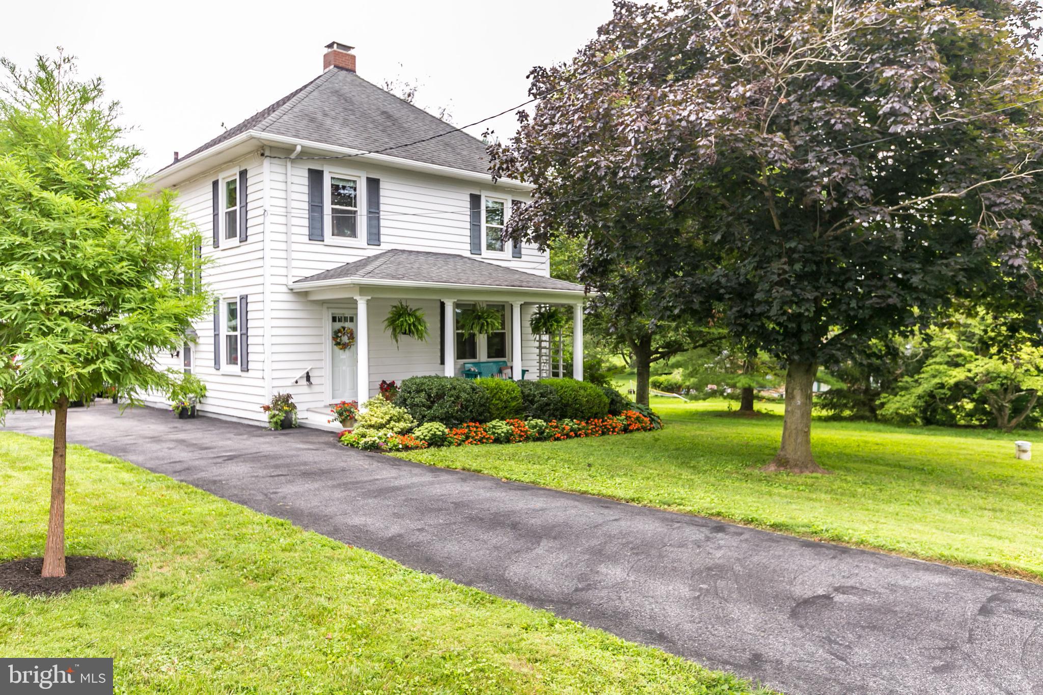 An absolute charmer in an ideal location! Come see this 99-year-old classic American Foursquare that has been lovingly maintained & updated by its long-time owner. The main level offers a living room with a woodstove insert, a dining room with a built-in china cupboard – both rooms have crown moulding; a modern kitchen with recent appliances (refrigerator 2014), (dishwasher 2017) and (microwave 2021); and an office/potential bedroom constructed in 2014 from the original mudroom that features a handicapped-accessible full bathroom. The upper level boasts three bedrooms and a renovated full bathroom along with a sunporch built in 2008 off the master bedroom.  The lower level (waterproofed with French drains installed in 2014) provides additional living space – perfect for a playroom, office, workout space or bedroom --  with a half-bath. All of this sits on a fabulous lot with mature trees and landscaping, a two-car garage with an attached screened porch and a workshop/garden shed. Some major recent improvements include a new well pump (2/21), a whole home reverse osmosis system (8/21), a water heater (8/21) and central air replacement (8/21). The seller has taken meticulous care of this house and it just feels like home. Located in a prime school district & the most convenient and desirable Northern Baltimore County neighborhood.