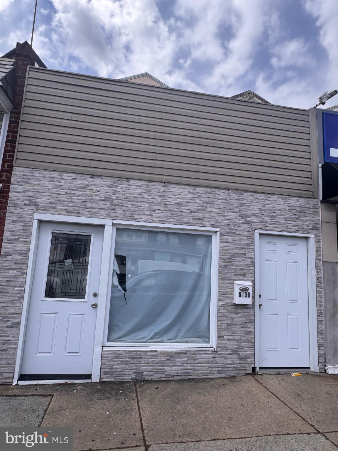 Fully renovated mixed-use property offering a strong investment opportunity in a prime location. The first-floor street-level commercial space features a central HVAC system, half bath, and flexible layout suitable for a variety of business uses, including retail or service-based operations. The space is move-in ready and well-suited for owner-operator or tenant occupancy, with estimated rental potential of approximately $2,100/month.

The upper levels consist of a spacious residential unit with a well-designed layout. The second floor includes an expansive living room, dining area, and a chef’s kitchen with stainless steel appliances. A full bathroom is also located on this level. The rear deck provides outdoor space and convenient access to a two-car driveway.

The third floor offers three well-proportioned bedrooms and one full bathroom. Hardwood flooring runs throughout the second and third floors, adding warmth and consistency to the living space.

The property is in excellent condition throughout and is truly move-in ready. Ideal for investors or end-users seeking a combination of residential comfort and commercial income potential.