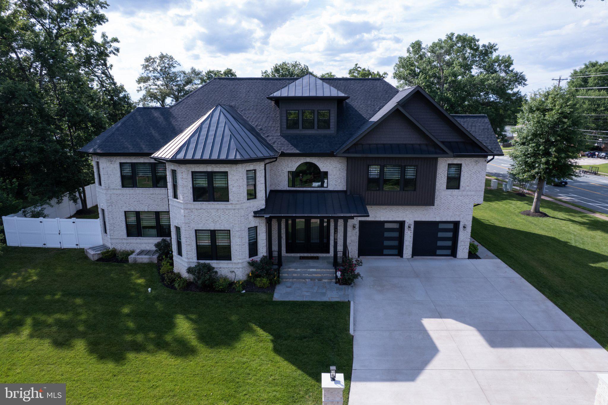 Welcome to this exceptional custom residence in the highly sought-after Chalet Woods community. Completed in 2023, this one-of-a-kind home offers over 12,300 square feet of thoughtfully designed living space across four finished levels, combining luxury, functionality, and modern comfort. Featuring 5 bedrooms and 7 full bathrooms, the home is designed to accommodate both everyday living and grand-scale entertaining. An elevator provides convenient access to every floor, while expansive windows and soaring ceilings create bright, open spaces filled with natural light. The chef’s kitchen is equipped with premium appliances, generous counter space, and abundant storage, making it equally suited for intimate family dinners or hosting larger gatherings. Multiple entertainment areas throughout the home include a private theater room, custom wet bars, and stunning outdoor living spaces. Enjoy evenings around the built-in fireplace, prepare meals on the outdoor grill, or unwind on the rooftop deck complete with its own fire pit. The spacious primary suite offers a private retreat with a spa-inspired bath featuring a Jacuzzi tub and steam shower. Additional highlights include whole-house water filtration, a recirculating hot water system, multiple HVAC systems, EV-ready garage spaces, and a dedicated pet washing station. Ideally located in Centreville, this remarkable property offers the privacy and feel of an estate setting while remaining just minutes from shopping, dining, parks, and major commuter routes. A rare opportunity to own a truly distinctive home offering exceptional space, craftsmanship, and modern amenities in one of Northern Virginia’s most desirable neighborhoods.
