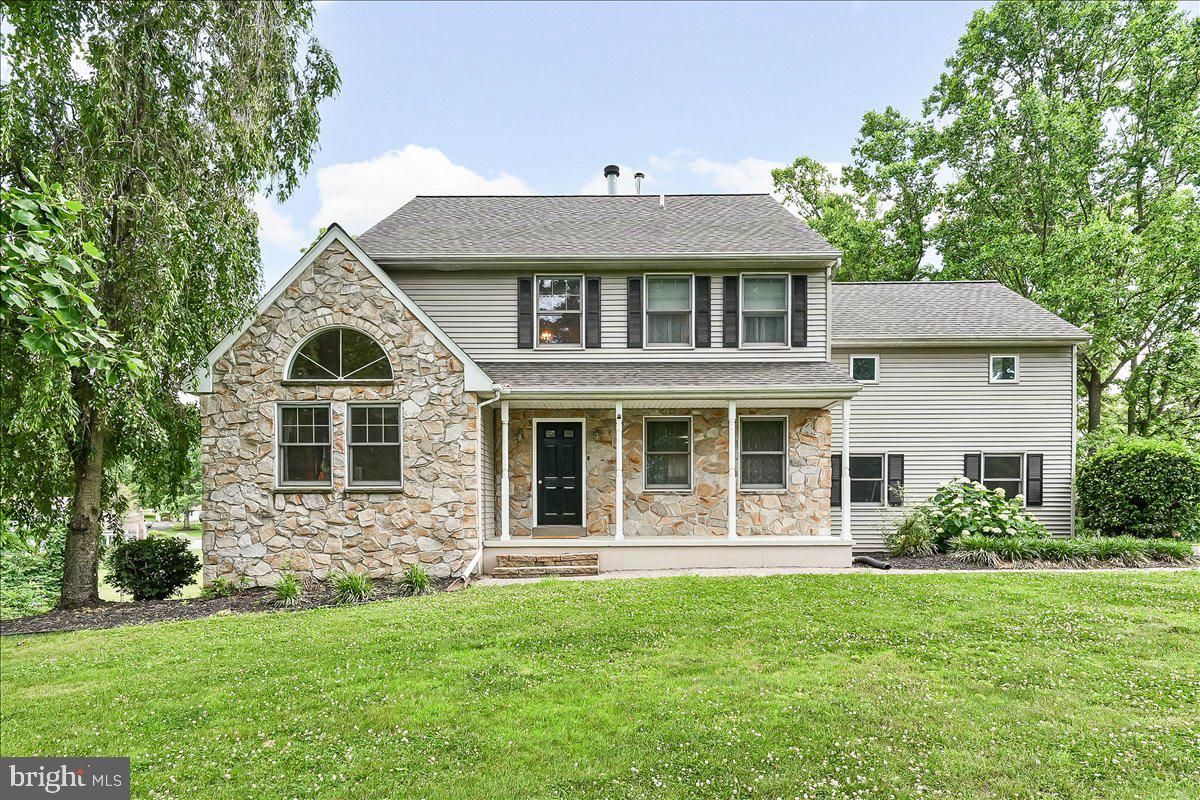 Welcome home to this beautiful stone-and-vinyl transitional Colonial on a premium cul-de-sac lot. Exceptional curb appeal abounds with a welcoming front porch, brick paver walkway, and a long paved driveway leading to a 2-car attached side-load garage. A 5-year-old architectural dimensional shingle roof adds ultimate peace of mind.

Inside, the vaulted foyer with hardwood floors flows into a carpeted formal living room and a formal dining room with pristine hardwoods. The hardwood flooring continues into the open-concept kitchen and breakfast area, equipped with Formica countertops, a center island, and a massive wall of built-in storage. Nearby, the cozy family room features hardwood floors, a slate fireplace, and a sliding door out to a large rear deck overlooking the expansive backyard. A main floor laundry room and powder room complete this level.

Upstairs houses four bright bedrooms and a hallway linen closet. The primary suite is a private retreat with plush carpeting, a walk-in closet, and an attached bath featuring vinyl flooring, a double vanity, a separate shower, and a whirlpool soaking tub. Three additional carpeted bedrooms offer great storage (single closets in bedrooms 2 and 3, double closet in bedroom 4) and share a vinyl-floored hall bath.

The space expands significantly in the fully finished walkout basement. Outfitted with durable vinyl flooring and recessed lighting, the lower level features a massive recreation/play room and a separate, private executive home office. Combining a fantastic location, timeless design, and modern updates, this turn-key gem is a rare find. Schedule your tour today! Owner Is a licensed agent
