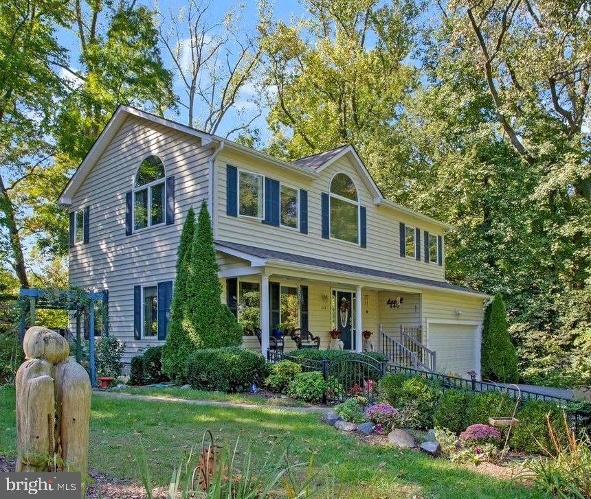 Welcome to your very own hilltop hideaway in the sought-after Herald Harbor community of Crownsville. Nestled on nearly half an acre and surrounded by mature trees, this beautifully maintained Colonial offers the perfect blend of privacy, comfort, and convenience.

Custom Built in 2008, this impressive home features 4 bedrooms, 3 full baths, 1 half bath, and over 3,200 square feet of living space across three levels. The inviting two-story foyer showcases gleaming hardwood floors and abundant natural light throughout the main level. The spacious family room, anchored by a cozy gas fireplace, flows seamlessly into the gourmet kitchen featuring a Greenhouse Window to grow your herbs / plants within handy reach, stained wood cabinetry, granite countertops, stainless steel appliances, pantry storage, and a breakfast area.  

Upstairs features New Upgraded Carpet (2025), the luxurious primary suite offers a spa-like bath with a jetted soaking tub, corner glass shower, double vanity, and a large walk-in closet. Three additional bedrooms, a full bath, and convenient upper-level laundry complete the second floor.

The finished walk-out lower level (new carpet just installed) provides exceptional flexibility with a full bath, recreation space, private exterior access, and potential for a fifth bedroom, home office, guest suite, or multigenerational living arrangement.

Outdoor living is equally impressive with a welcoming front porch, fenced yard area, multiple rear decks overlooking the peaceful, wooded backyard creating a true backyard sanctuary. Additional highlights include Leaf Filter gutter system, Dual HVAC Systems a large oversized 2-car attached garage with tons of space with a new opener installed in 2025, offers additional storage and there is ample driveway parking.   New Water Heater just installed 2026

Enjoy a charming neighborhood atmosphere featuring a local Convenience Store / Restaurant, nearby water access, local dining, parks and marinas. Commuters will appreciate the convenient location near Annapolis, BWI Airport, Fort Meade, NSA, and major commuter routes.

Experience the perfect balance of nature, privacy, and modern living.