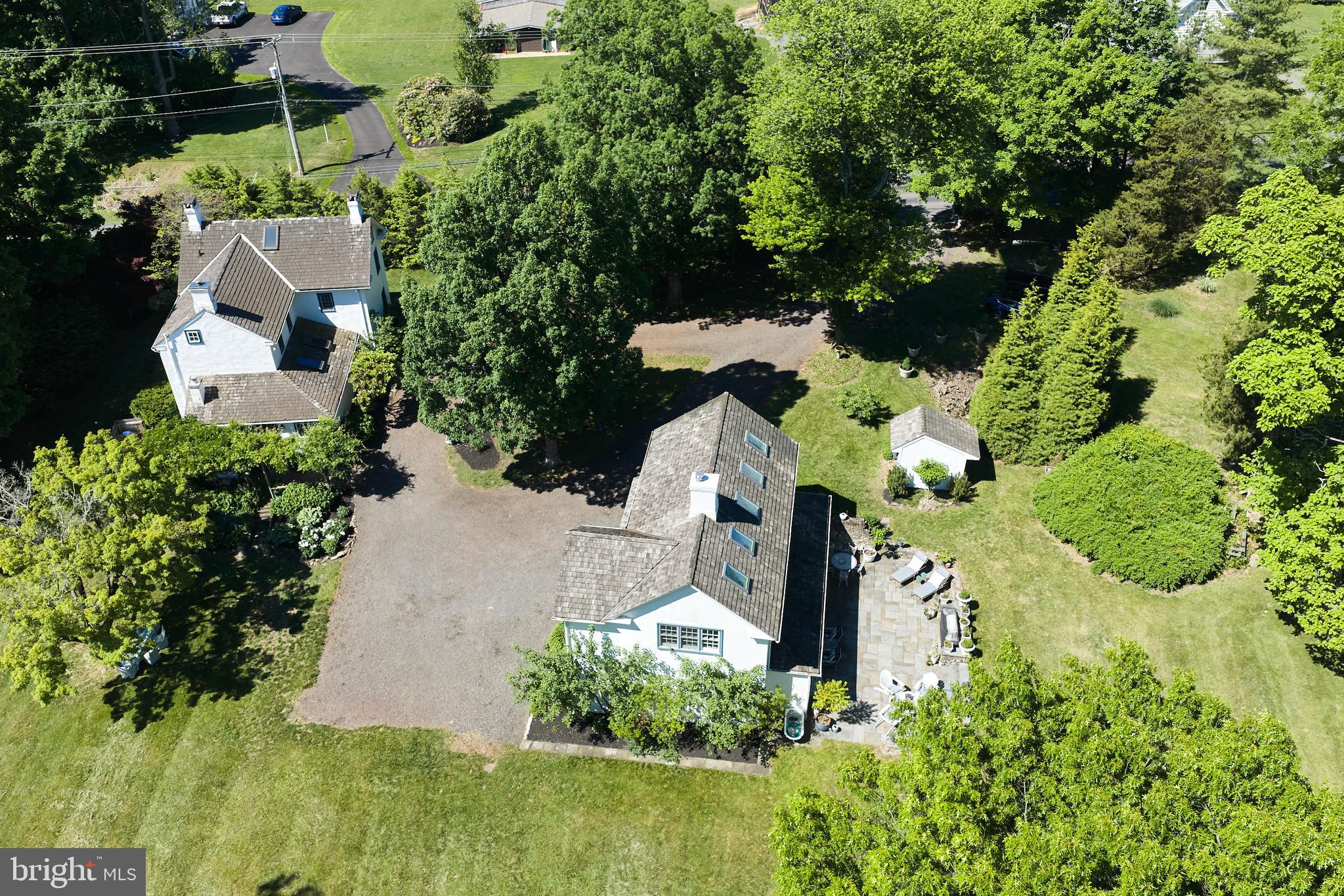 Welcome to year-round resort living at 310 Durham Road!  This elegant compound exudes luxury, charm, and sophistication, and offers an experiential lifestyle to rejuvenate your soul!  Located in serene Tinicum Township, Bucks County, this nearly 3 acre property includes the Main House built during the mid-18th & early 19th centuries, a recently constructed Carriage House, and a magnificent Pool House.  The historic Main House, with newer shake roof, windows, kitchen and baths, has been maintained and expanded with respect to preserving the original architectural integrity.  Entering the front door with period hardware, you will be taken by the openness of the spacious Living and Dining Rooms, each with woodburning fireplaces.... the perfect venue for quiet evenings at home or hosting dinner parties with family & friends.  The clean & neutral color palate and light colored wide-plank flooring will serve as a pleasing backdrop to showcase your most treasured art and collectables.   Enter the cozy Family Room, and you will note the grand walk-in fireplace outfitted with a wood stove, and high, wood-beamed ceilings.  The adjoining gourmet kitchen has been designed with no expense spared.... custom cabinetry, quartz countertops, Bosch appliances, and magnificent Italian tilework.  This wonderfully functional space can accommodate multiple chefs, and opens to an intimate Breakfast Room, complete with fireplace fitted with a gas stove.  The perfect place for morning coffee!  Step out to the Trumpet Vine covered stone patio for an intimate dinner.... you and your guests will be transported to the charm of the South of France!  A convenient first-floor Full Bath features exposed stone, steam shower, and bidet toilet.  Upstairs, the sundrenched Primary Bedroom features a woodburning fireplace, and a luxurious en-suite bath, complete with original fireplace with propane hookup and deep soaking tub.  Perfect for relaxing on winter nights!  A spacious Guest Room and Hall Bath complete the 2nd floor.  Upstairs, the finished attic can be used for additional sleeping space, storage, or office. 

Across the driveway, a beautiful Carriage House has been recently constructed to complement the period architecture of the Main House.  Enter the spacious fully-equipped gym and also find a luxurious full bath and 4-person dry sauna.  Upstairs, an expansive studio space can accommodate a multitude of uses, and features wonderful outdoor views and cozy woodburning stove.  Outside, extensive hardscaping is a fabulous venue for large gatherings or quiet afternoons at home. 

To the rear of the property, you will find an expansive heated salt-water pool and breathtaking Pool House, a perfect summer gathering spot!   Marvel at the soaring architectural elements of this elegant structure, complete with wood-burning fireplace, and intimate spaces for dining & lounging.  The push of a button activates the electronic screens on 3 sides to keep your evening gatherings enjoyable. 

Enjoy the delights of Frenchtown and New Hope, a few minutes away. 

Make your appointment today for a glimpse of your elevated lifestyle at this magnificent property.  More than a home.... an entertainers dream!