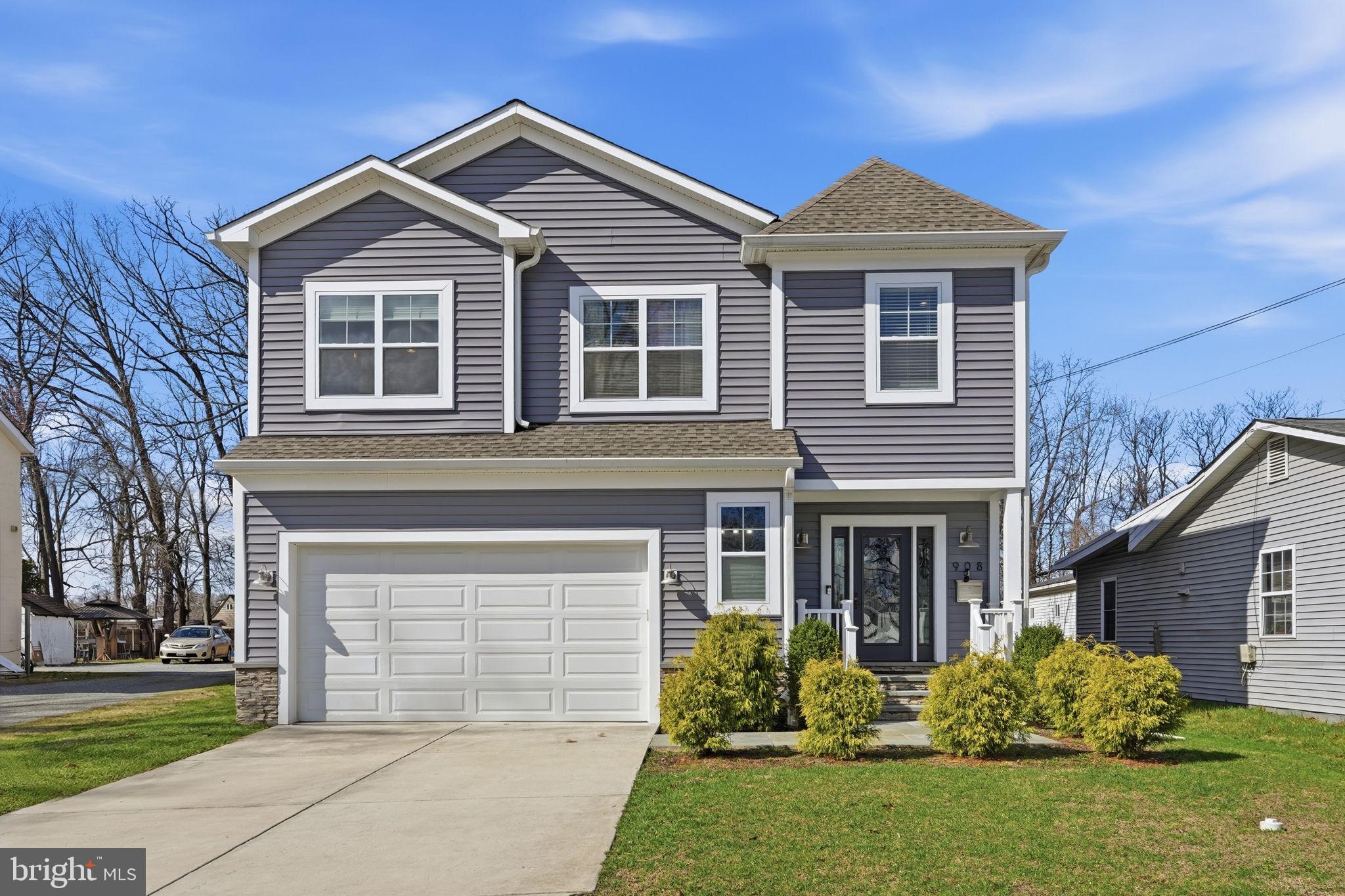 NEW PRICING! Built from the ground up in 2018 with all new infrastructure including plumbing and electrical throughout, this Rockville home is the one that checks every box on your list. Coffered ceilings, dark hardwood floors, a tray ceiling in the living room, and a modern gas fireplace set the tone the moment you walk in.

The heart of the home is a chef's kitchen that opens right into the living and dining areas, featuring a large granite island, white shaker cabinets, gray subway tile backsplash, gas range, and black stainless steel appliances under double pendant lantern lighting. Whether it's a weeknight dinner or a weekend gathering, this kitchen was built for it.

The primary suite is its own retreat with an oversized walk-in closet, sun-filled windows, and a spa-like bath featuring a double vanity with premium countertops, a large walk-in glass shower, and a soaking tub. The finished lower level adds a whole second living space with its own separate entrance and windows that bring in natural light, great for guests, in-laws, or just extra room to spread out.

Steps from Rockville Town Square and the Rockville Metro Station, with grocery stores, restaurants, and fresh local bakeries all nearby. Located in the sought-after Richard Montgomery school district. Two car garage, a spacious fenced backyard with additional property extending beyond the fence line and no HOA.
Turnkey, thoughtfully built, and ready for you to move in and make it your own.