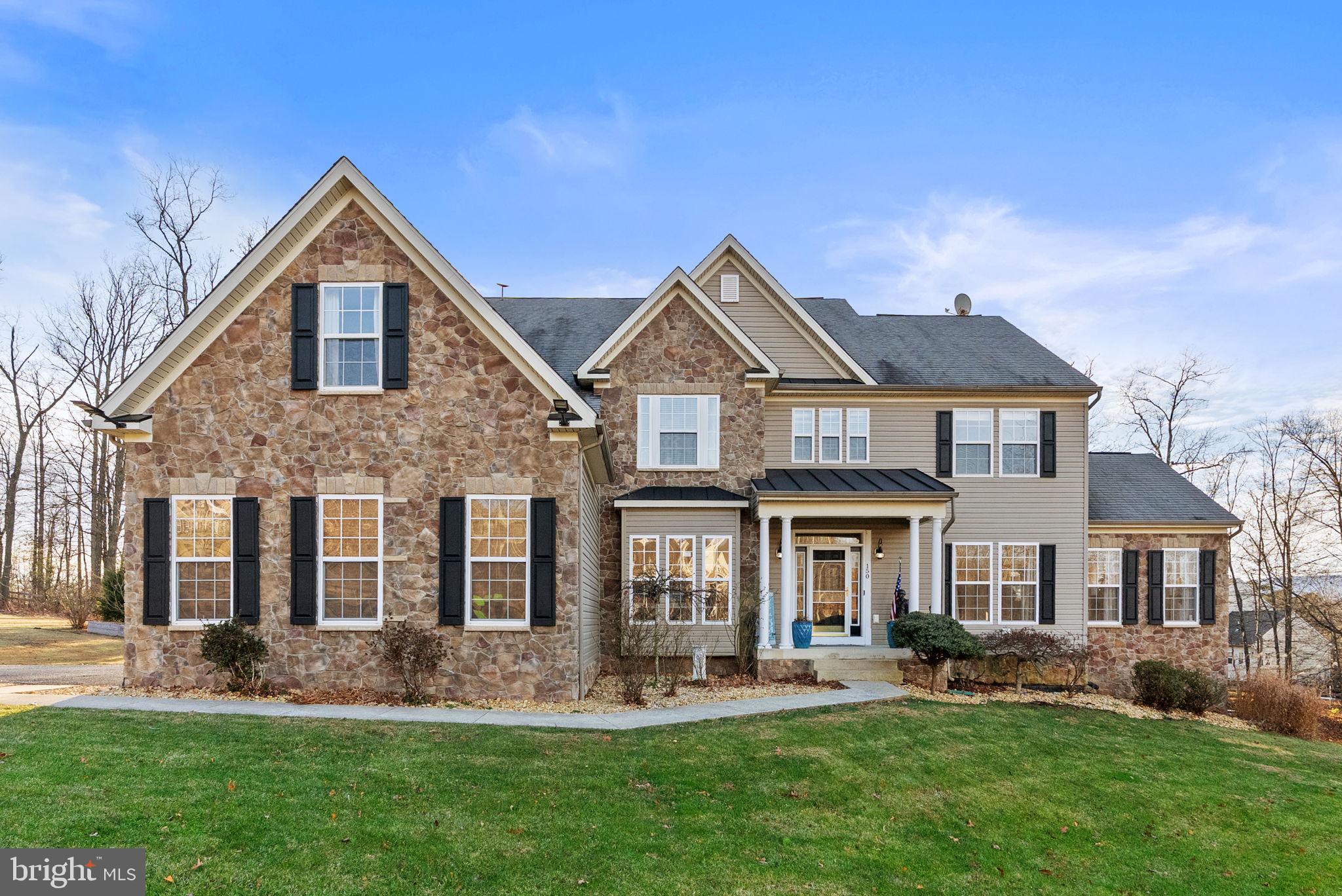 Welcome to Equestrian Estates, a highly sought-after Winchester community with no HOA, where space, style, and flexibility come together beautifully. This stately 5-bedroom, 6-bath Colonial offers over 6,700 square feet of finished living space on nearly 3 private acres, creating the perfect setting for both everyday living and entertaining.

The home was not available for showings over the past three months. During that time, several rooms were freshly repainted, and new carpet has been installed in the basement—enhancing both comfort and appeal.

Originally built in 2007 and thoughtfully updated in 2020, the home shines with high-end finishes throughout, including fully renovated bathrooms featuring luxury touches such as smart toilets and heated floors in the primary suite, along with upgraded kitchen appliances. Sunlight fills the open-concept living, dining, and sunroom areas, highlighting the warm, inviting flow of the home. A dual staircase, gas fireplace, private office, and a built-in kitchen desk make the layout as functional as it is elegant.

Three of the five bedrooms—including the spacious primary suite—offer private en-suite baths, providing comfort and privacy for family and guests alike. The fully finished lower level adds 1,714 square feet of living space and features two generous flex rooms ideal for guests, a home gym, or creative workspace, plus a second kitchenette, full bath, and theater room. With private walkout access, this level is perfectly suited for entertaining or multi-generational living.

Outdoor living is just as impressive, with expansive decks, a beautifully designed hardscape patio set away from the home with a wood-burning chimney stack, and a flourishing garden that adds charm and privacy. A three-car garage, quiet cul-de-sac location, and easy access to Route 50 and downtown Winchester complete this exceptional offering.

This is a home that truly delivers on space, elegance, and lifestyle flexibility—inside and out.