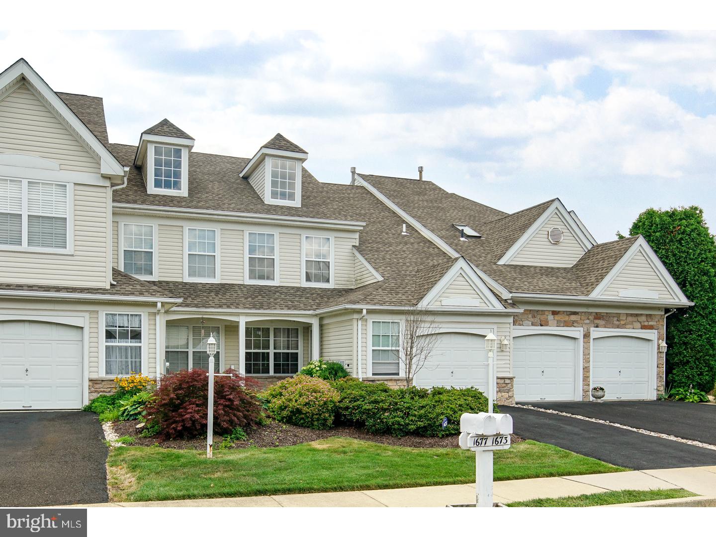 Fantastic townhome ideally located in the desirable Windrush development in Warwick Township! This gorgeous home has been well-maintained and upgraded throughout! Features include:  Newer hardwood flooring throughout adjoining living and dining rooms! Dramatic two-story family room with newer hardwood flooring, recessed lighting and access to the spacious rear deck! The kitchen has been recently updated with granite counters, tile backsplash and flooring and stainless steel appliances! A powder room completes the main floor! The second floor features a spacious master bedroom suite with an elegant tray ceiling and a large walk-in closet! The private master bath features a sumptious soaking tub and stall shower! A spacious second bedroom, full hall bath and laundry finish off the second floor! Newer neutral painting throughout! One-car attached garage with great storage space! Conveniently located to major roads, transportation, great shopping, and  restaurants! Affordable HOA fee covers snow and trash removal and lawn maintenace! Make your appointment today to see this gorgeous home! This one won't last!