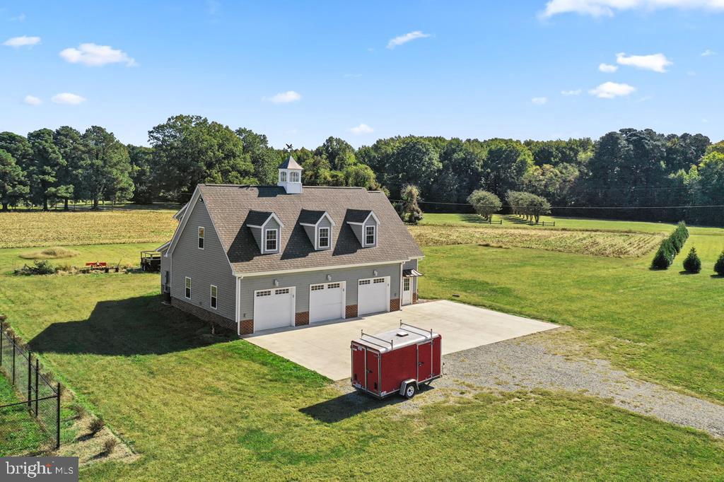 This unique property is a rare find! With a huge three bay garage, a workshop area, an upstairs apartment, and all on just over 32 acres of land, this property has it all. The land consists of three separate parcels all under one tax id, which mostly is in agriculture at present. This could be an investment opportunity where the land could be developed into a residential neighborhood or one could simply enjoy the peace and tranquility on 32 acres. Directly beside the garage/apartment is an enormous, fenced in garden with six hydrants throughout. The garden is equipped to grow just about anything you desire and includes a single wire trellis for grape vines as well as a few matured fruit trees. In addition to the excellent storage space, the garage provides a half bath and a gas fire place, to create a comfortable hang out spot. The workshop, also downstairs, includes a compressor for anything you may need to hook up, making the workshop a wonderfully versatile space. Upstairs you will find a spacious one bed, one bath apartment with granite countertops, an eat in kitchen, a gas fireplace, and brand new appliances. This structure also includes a Rinnai water heater for the entire building. Give us a call to view this one of a kind property!