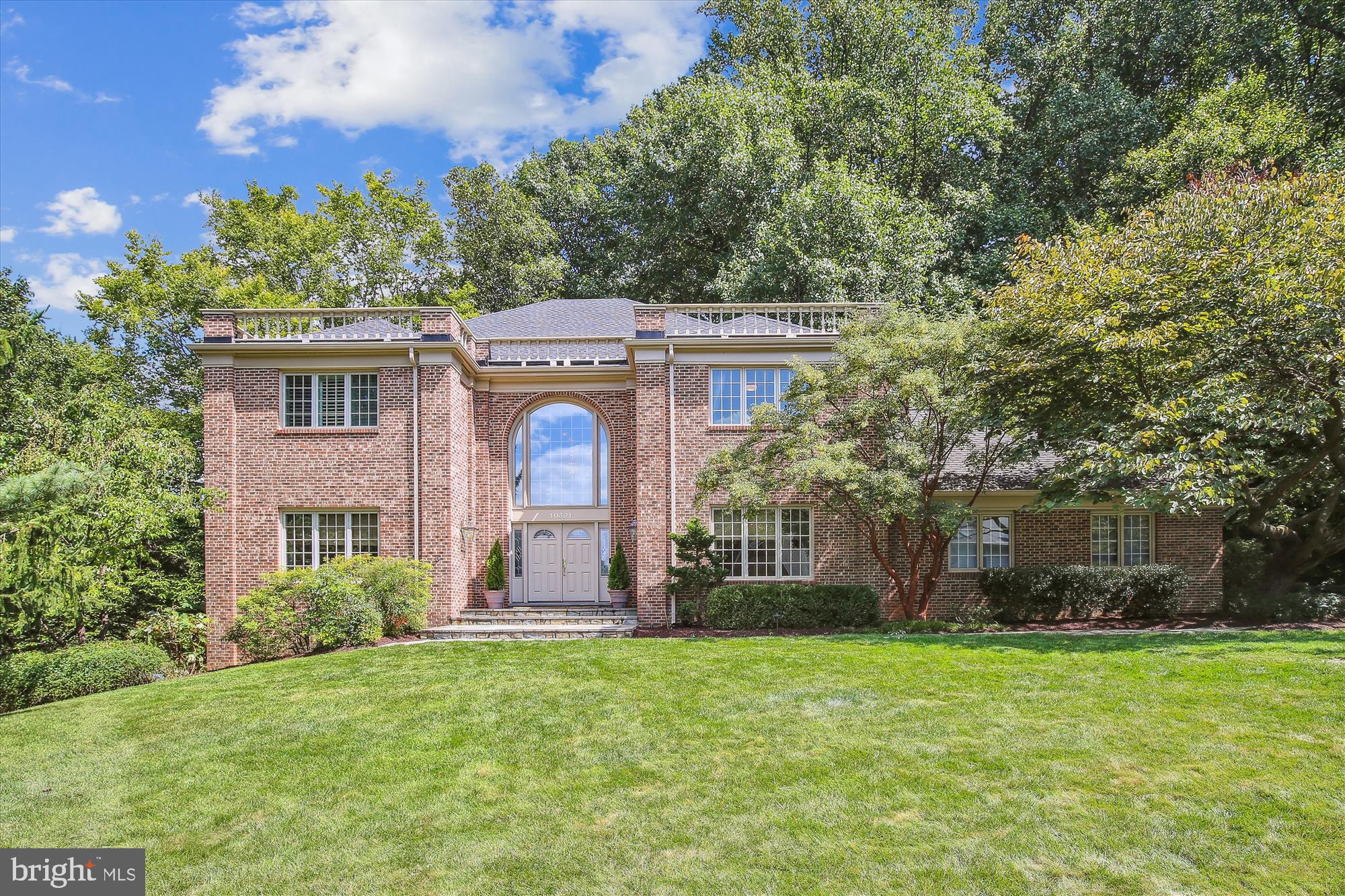 Welcome to 10321 Hickory Forest Drive - an exceptional Oakton residence in Hickory Hollow Forest an enclave of 21 custom homes. Prepare to be impressed with this 5 bedroom (optional 6th), 4 full bath custom estate that is sited on a park-like .57 acre lot. With impressive curb appeal, it features a slate walkway to the front porch and double doors to the two story foyer which leads to an inviting floor plan with spectacular formal and informal spaces.  This meticulously maintained home offers only the finest quality and finishes throughout. Boasting more than 6,000 sf of functional living space and over $600,000 in updates this home was made for gathering and entertaining with a spectacular custom kitchen that opens to a large deck with handicap accessible ramp, a lodge style great room with fireplace, built-in seating and wonderful views of nature, and a lower level that houses a state of the art theatre complete with automated cinema curtain.  The home offers an ideal environment for multi-generational living with an incredible primary suite on the upper level, a main level bedroom adjacent to a full bath and a lower level in-law suite with double doors to a private garden, plus 2 additional spacious upper level bedrooms that share a hall bath.  The attention to detail is unsurpassed with custom doors and Anderson art glass windows, hand crafted built-ins, hardwoods on 2 levels, a renovated kitchen and 4 renovated baths.  The parklike setting is a dream with a private garden, koi pond, and walking paths through the trees, enjoy entertaining on the deck, or a quiet evening on the patio watching nature unfold.  Public water and sewer are a bonus and allow for the potential to add a pool.  Desirable Oakton Elementary, Thoreau Middle, Oakton High School pyramid. Minutes from the Oakton Shopping Center with Starbucks, CVS and Giant, and quick access to major commuter routes - 66, 495 and the Toll Road, 3 miles to the Vienna Orange Line Metro.
