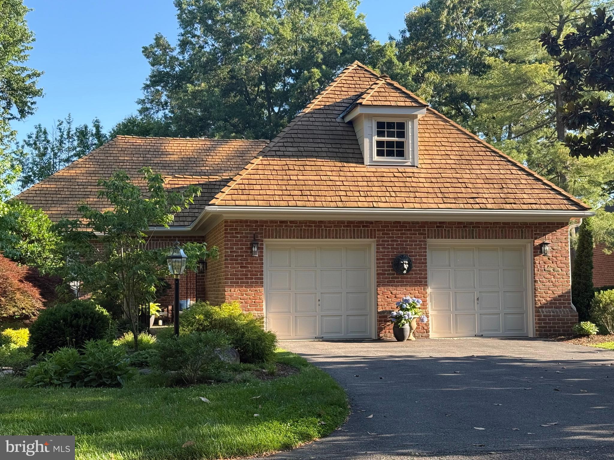 Set within the gated enclave of South River Landing, 1010 S River Landing Road is a beautifully updated brick residence offering one of the community's most coveted assets: a deeded 35-foot slip with a 10,000-pound electric lift and direct water access from Almshouse Creek to the South River. In a community where slips are scarce and sought-after, this property delivers the full Chesapeake Bay lifestyle without compromise.
The main level has been thoughtfully reimagined, anchored by a fully remodeled kitchen outfitted with Miele appliances, a double oven with microwave and convection combination, a cabinet-front dishwasher, quartz countertops, and a skylight that draws natural light deep into the space. Beautiful hardwood flooring carries through the main level, connecting the kitchen to the dining area and into the living room, where vaulted ceilings and a wood-burning fireplace command the space.
The primary suite, conveniently located on the mail level, opens to the deck and features a skylit bath with soaking tub, walk-in shower, double vanity, and marble accents. A second bedroom and full bath are also located on the main level, alongside a dedicated laundry room.
The finished walkout lower level expands the home's footprint considerably, offering a family room anchored by a gas fireplace, a third bedroom, full bath, game room, and bonus room suited for a home office, gym, or guest accommodations. Newly installed wide-plank, white oak flooring elevates and lightens  the space. The outdoors is again accessible onto a terrace for ease of entertaining, grilling or lazing the day away on hammock. A finished, climate controlled storage room completes the level.
Outdoor living is thoughtfully considered. A deck, accessible from both the living room and primary suite, provides a natural extension of the main living spaces. A front courtyard enclosed by wrought iron fencing and framed by a pergola creates a gracious arrival, while a patio off the lower level adds a third private outdoor space. An irrigation system maintains the landscaping, and a whole-house Generac generator ensures uninterrupted peace of mind.
Community amenities include a newly refurbished pool, marina, tennis courts, and gated 24 hr security, with lawn maintenance covered by the condominium association. The location places residents within easy reach of Annapolis, Baltimore, and Washington, D.C.
This residence stands as a rare combination of finished detail, deeded water access, and community infrastructure in one of the South River's most established waterfront enclaves.
