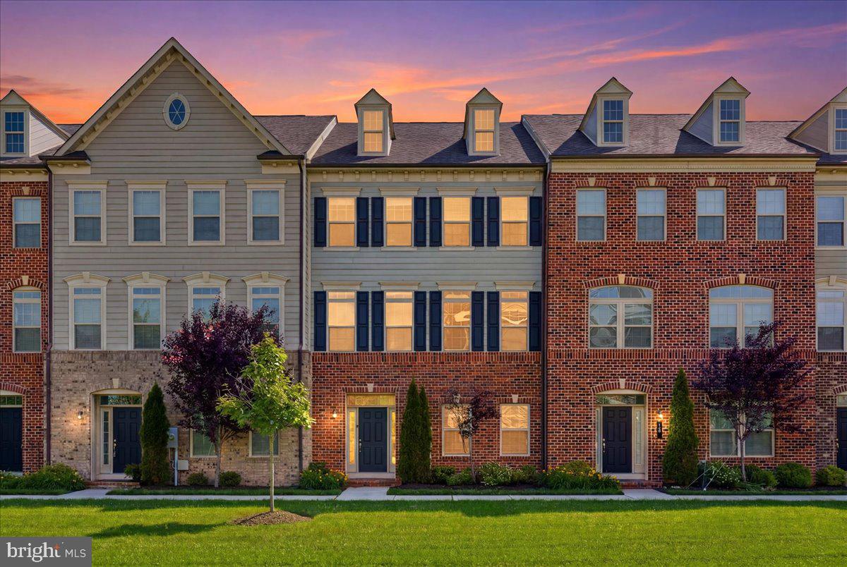 Welcome to this stunning brick front townhome in the highly sought after gated community of Suburban Greene in Pikesville. Offering 4 bedrooms, 3.5 baths, and a spacious 2 car garage with a professionally epoxied floor, this beautifully maintained home combines luxury, comfort, and modern convenience.
The entry level features a tiled foyer, ample storage space, and a private bedroom with a walk-in bathroom, making it ideal for guests, extended family, or a home office. The main level showcases an open-concept design with gleaming hardwood floors and abundant natural light. The gourmet kitchen is a true centerpiece, featuring an oversized island, granite countertops, elegant white cabinetry, stainless steel appliances, a cooktop with stainless range hood, wall oven, and a walk-in pantry. The kitchen flows seamlessly into the bright living room with a cozy fireplace and French doors leading to the rear deck. A spacious dining area, convenient desk nook, and powder room complete this level. Upstairs, the luxurious primary suite offers two walk-in closets and a spa-inspired bath with dual vanities and a separate shower. Two additional generously sized bedrooms, a full hall bath with dual vanity, and a dedicated laundry area provide both comfort and functionality. New carpet throughout the upper levels adds a fresh, updated feel. Additional upgrades include a smart thermostat and an energy-efficient tankless hot water heater. Located in a secure gated community with convenient access to shopping, dining, major commuter routes, and everything Pikesville has to offer, this exceptional home is ready for its next owner.