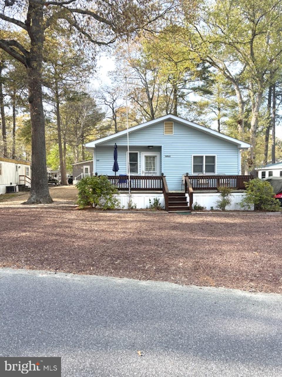 Welcome to this well maintained cottage like home by the sea in West Bay Park. This was a single wide with an addition added on. Tons of sunlight and areas to entertain or just relax in the suns light. It is a two bedroom with a bath for each bedroom. A shed is in the back for plenty of storage. A community pool is not far away.