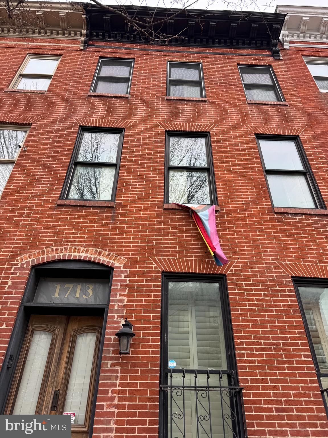 Discover an exceptional investment opportunity in the heart of Hollins Market! This interior row townhouse with solid red brick construction is the timeless design in the neighborhood. This property is poised for significant appreciation. Step inside to find an inviting open floor plan that maximizes space and natural light. The wood floors add warmth and character, while the eat-in kitchen, equipped with essential appliances like a dishwasher and refrigerator. The dining area seamlessly connects to the living space, creating an ideal environment for entertaining or relaxing. The upper floor laundry adds convenience, making this property attractive to potential renters or future homeowners. The poured concrete floor in basement offers additional storage. Located less than a mile from public transportation, this townhouse is strategically positioned for easy access to the vibrant community of Hollins Market, known for its shops and dining options. With ample on-street parking available, this property is not only a comfortable residence but also a smart investment in a growing area. Seize this opportunity to own a piece of history with modern amenities, and watch your investment flourish in a desirable neighborhood!