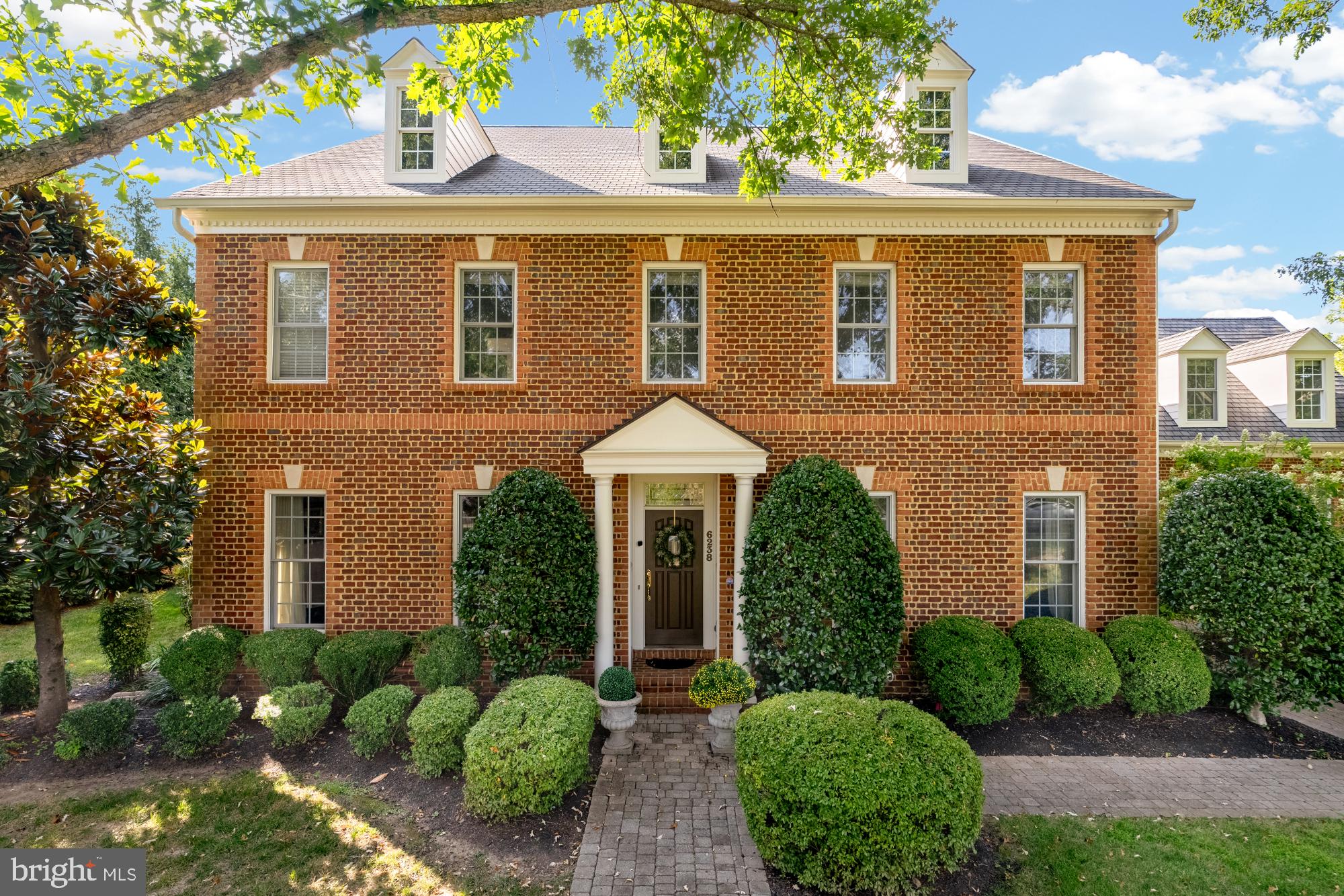 Sophisticated living meets unparalleled convenience in one of McLean's most coveted addresses. This exceptional 7,762 square foot all-brick colonial showcases timeless architecture across four thoughtfully designed levels.
From the three-car garage, you enter through a convenient mudroom that connects seamlessly to the chef's kitchen, where granite countertops, premium stainless steel appliances, and abundant cabinet space create an ideal workspace. The open-concept design flows directly into the family room, while the spacious eat-in kitchen area comfortably accommodates a large dining table.
The family room features wrap-around windows that flood the space with natural light and stunning views of the backyard oasis. French doors open directly to the deck and pond area, creating seamless indoor-outdoor living. A sophisticated main-level office with built-in bookcases provides the perfect work-from-home space, while formal living and dining rooms offer elegant entertaining options.
A private staircase in the mudroom leads to the loft suite - a completely separate apartment-like space that feels entirely independent from the main house. This sunny sanctuary offers complete privacy and flexibility for home office, guest quarters, or multi-generational living.
The second floor features the primary bedroom with cozy fireplace, breakfast bar, and tranquil sitting room, while dual walk-in closets provide exceptional storage and the spa-like master bath creates a luxurious daily experience. Three additional well-appointed bedrooms and two full bathrooms ensure comfort for family or guests.
The third floor provides additional finished living space, offering flexibility for home office, media room, or extra guest accommodations.
The walk-out basement expands living options significantly. The recreation room features a fireplace and connects to a game room and wet bar - ideal for entertaining. A dedicated exercise room eliminates gym memberships, while additional rooms provide storage and flexibility.
The professionally landscaped grounds feature a stunning waterfall and koi pond, creating a serene backdrop for morning coffee or evening relaxation. The elevated deck and stone patio provide multiple outdoor entertaining options, while mature plantings ensure year-round beauty with manageable maintenance.
Recent thoughtful updates inclue water heater, and fresh interior and exterior paint, ensuring move-in readiness and peace of mind. Custom plantation shutters throughout add both elegance and energy efficiency. The prime location backing to parkland provides privacy and tranquility, while remaining walking distance to Chesterbrook Shopping Center for daily conveniences. You'll be just minutes from downtown D.C., Tysons Corner, and top-rated schools.
This is more than a home - it's sophisticated living with the space and flexibility of a large residence, yet manageable outdoor maintenance perfect for any stage of life. The thoughtful layout makes elevator installation entirely possible for future accessibility.
You'll enjoy privacy backing to parkland while maintaining convenient access to downtown D.C., Tysons Corner, and top-rated schools. Welcome home to where luxury meets livability.