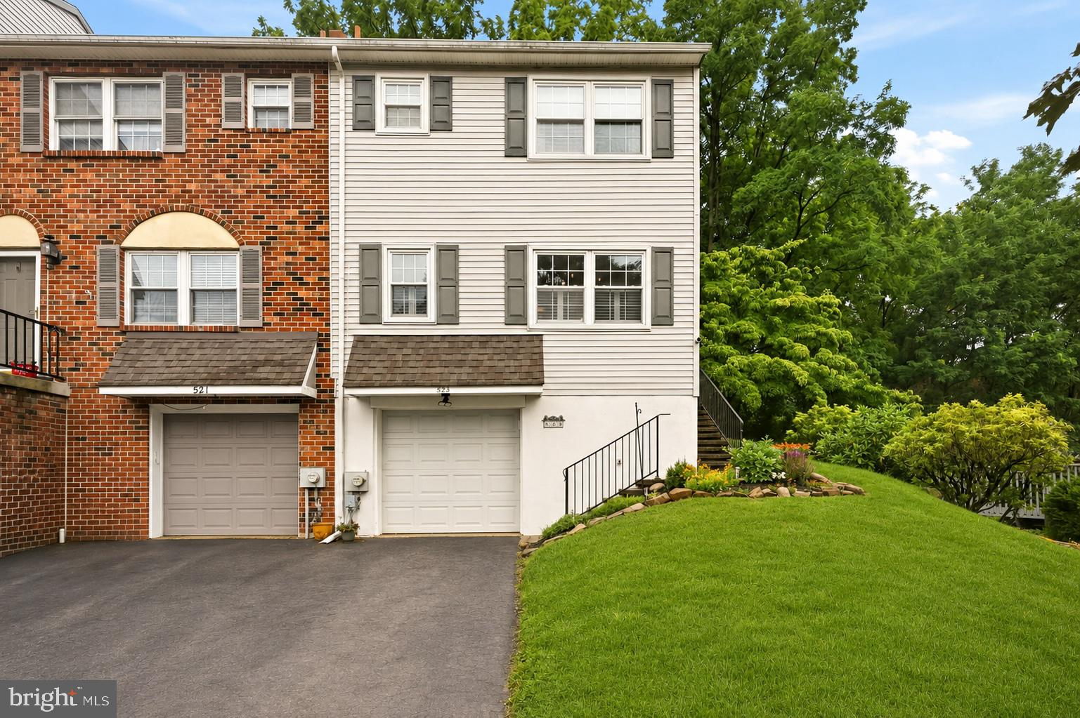 Located in the highly desirable Coventry Village community just outside West Chester Borough, this meticulously maintained 3-bedroom, 2.5-bath END UNIT townhome offers affordable living in the sought-after West Chester Area School District — with low taxes and low HOA fees to match!
This incredible home lives like a single-family home with its open, modern layout and a private, tree-lined backyard that you can FENCE-IN!!! Yes, you read that correctly... a townhome where you can fence in the backyard!
Step inside and you'll immediately notice gleaming hardwood floors flowing throughout the main level, accented by beautiful plantation shutters. The foyer is flanked by a conveniently placed powder room and a large coat closet. As you enter, to the left you'll find a beautifully updated kitchen with white cabinetry, granite countertops, a glass tile backsplash, and stainless steel appliances, along with an overhang that comfortably seats 4, flowing seamlessly into the dining area. Across the spacious main level sits your generously sized living room, featuring an electric fireplace and a sliding glass door leading to your oversized composite deck and backyard sanctuary. This end unit feels ultra private, with a privacy wall between you and your neighbor and an expandable awning for shady summer evenings.
Upstairs, the owner's suite includes a walk-in closet and an en-suite bathroom with an updated vanity, plus 2 additional bedrooms and a hall bath. The finished lower level provides even more flexible living space with a rec room, a large laundry and utility room with plenty of storage, and an oversized one-car garage with an additional storage nook.
Move-in ready and ideally located just minutes from Routes 202 and 3 and less than five minutes from the heart of West Chester Borough, this home offers everything buyers love about Coventry Village: low HOA fees, the rare ability to fence your backyard, and an unbeatable location. It's easy to see why this community is one of the area's most sought-after neighborhoods.