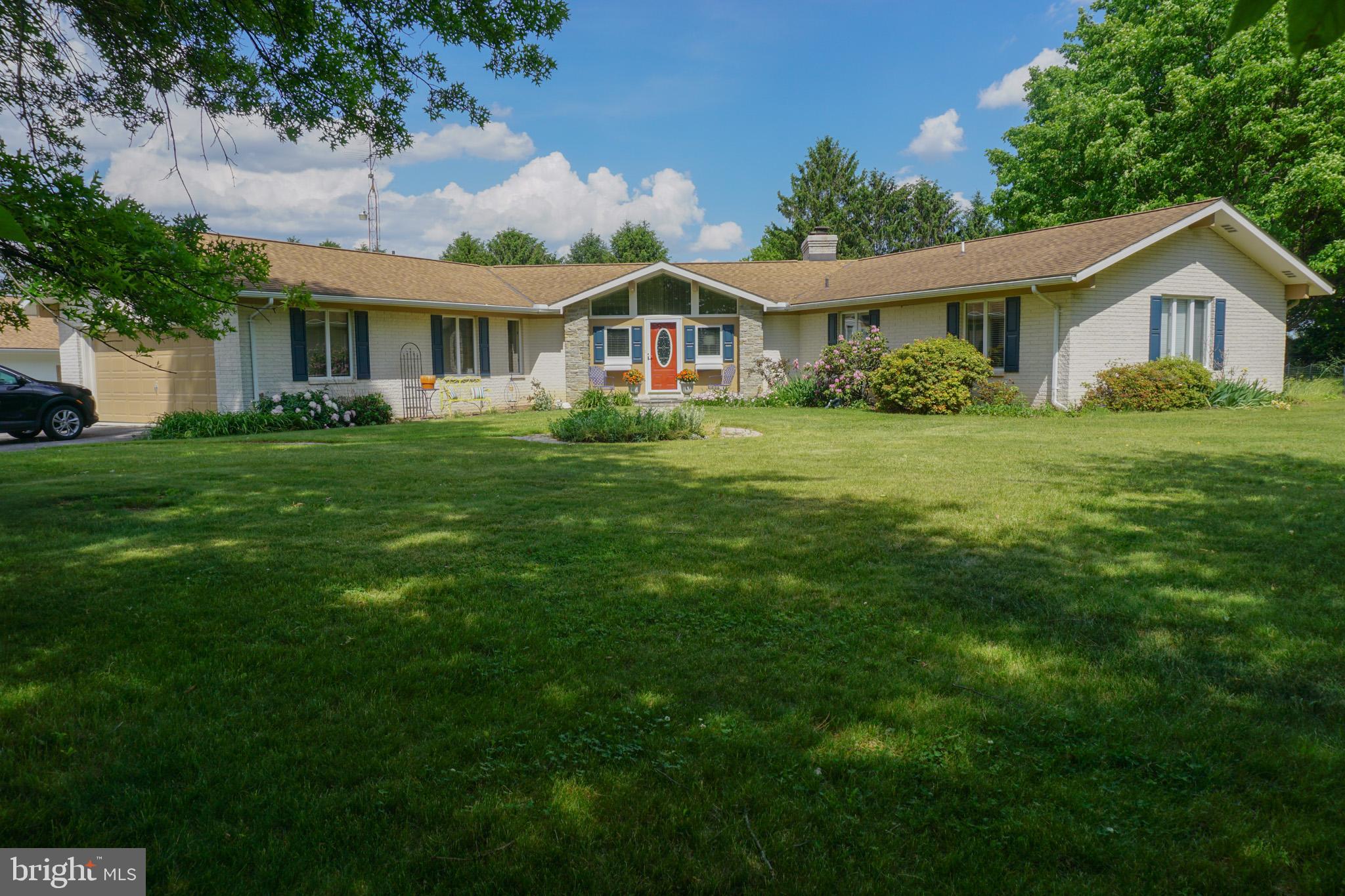 Property to be sold at PUBLIC AUCTION on September 26, 2026 at 11:30am. $30,000 dollar deposit to from winning bidder day of auction. Buyer’s Premium 6% on hammer price. Sales price = hammer price + buyer’s premium. 2% transfer tax to be split equally between seller and buyer. No offers accepted prior to auction day. Property will be sold with seller confirmation.  Personal Property Auction 8:30 am and Personal Property Auction wood working machinery after the Real Estate Auction. 
One-floor living at its finest! This spacious 3-bedroom, 2 full and 1 half bath ranch home features a finished walkout lower level, custom round kitchen, stunning stone fireplace, and a bright 3-season room. There is an additional room in the lower level that could be used as a bedroom or office. The house has a heat pump with a supplemental woodstove. An attached 2-car garage adds convenience and functionality. Situated on 2.4 acres, the property also includes an incredible 7,000 SF workshop complete with showroom and bathroom. There are two large overhead doors, a spray booth, and a dust collection system. The heat for this building is oil. The building has been used for custom cabinetry for 35+ years! The cabinet-making business is grandfathered in and may continue as long as operations have not ceased for more than 12 consecutive months.