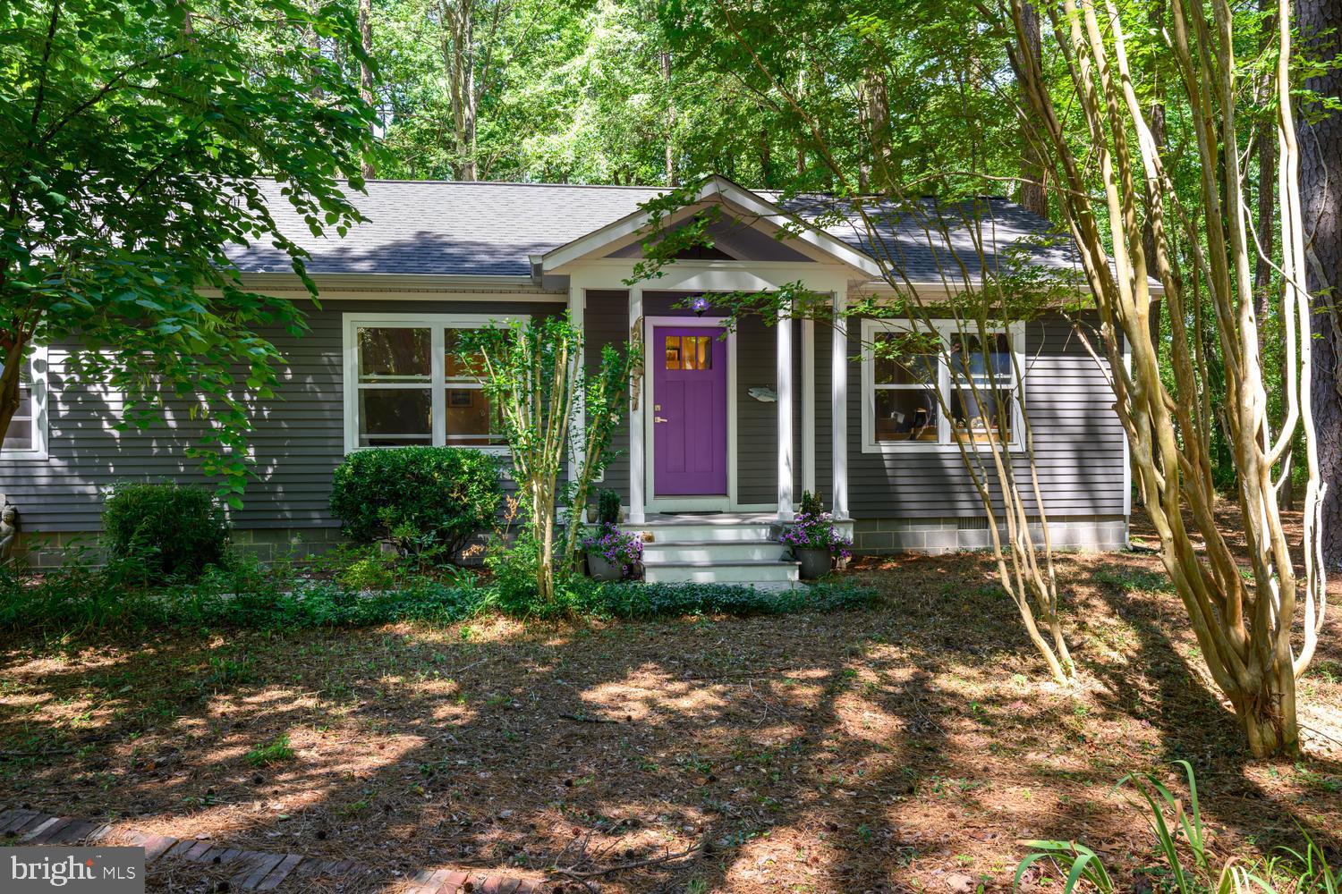 Nestled beneath a cathedral of mature trees in sought-after Rio Vista, this beautifully updated home offers the perfect blend of privacy, convenience, and future potential. Extensively renovated between 2020 and 2024, the home features a well-appointed kitchen, spacious living areas, and a stunning screened porch that creates inviting spaces for everyday living and entertaining. The wooded setting provides a peaceful retreat while offering convenient access to nearby schools, the YMCA, and all that historic downtown St. Michaels has to offer. Located just outside town limits, the property benefits from no town taxes while still enjoying close proximity to shops, restaurants, the waterfront, and local attractions. Modern conveniences include fiber-optic internet service through Breezeline, providing reliable high-speed connectivity for work, streaming, and everyday living. As an added benefit, the seller has invested in professionally prepared architectural plans and obtained HOA approval for a thoughtfully designed detached accessory building, providing a valuable head start for a future owner seeking additional space for hobbies, recreation, storage, fitness, workshop, or office use, subject to any additional approvals required. Residents of Rio Vista enjoy access to two community waterfront areas, including boat launches and boat slips, offering wonderful opportunities to enjoy the Chesapeake lifestyle.  This is a rare opportunity to enjoy an established neighborhood setting with extensive updates, exceptional privacy, modern connectivity, waterfront community amenities, no town taxes, and exciting possibilities for the future.