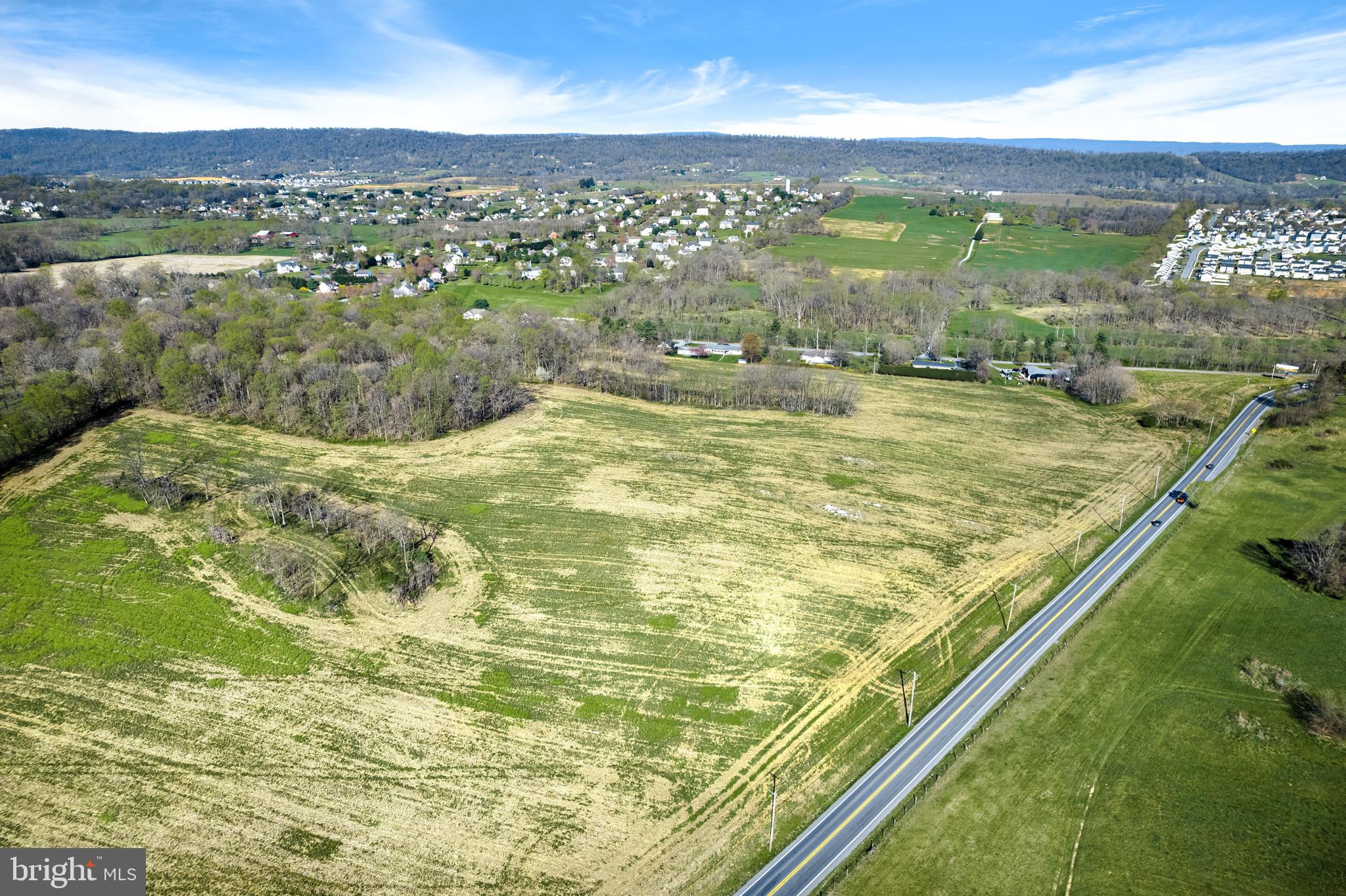 This property has a variety of features that make it perfect for development, including easy access from two roads, Rt 9 Hedgesville Road and Welltown Rd as well as public water and sewer available. With 44 acres of land, mostly open, this property has great potential to be developed into residential or commercial properties, providing ample opportunity for multiple uses. Additionally, the area is growing and has a high traffic count, making it even more attractive. If you're looking to purchase and develop land, this property could be the perfect fit! Don't wait—call today to arrange a showing.