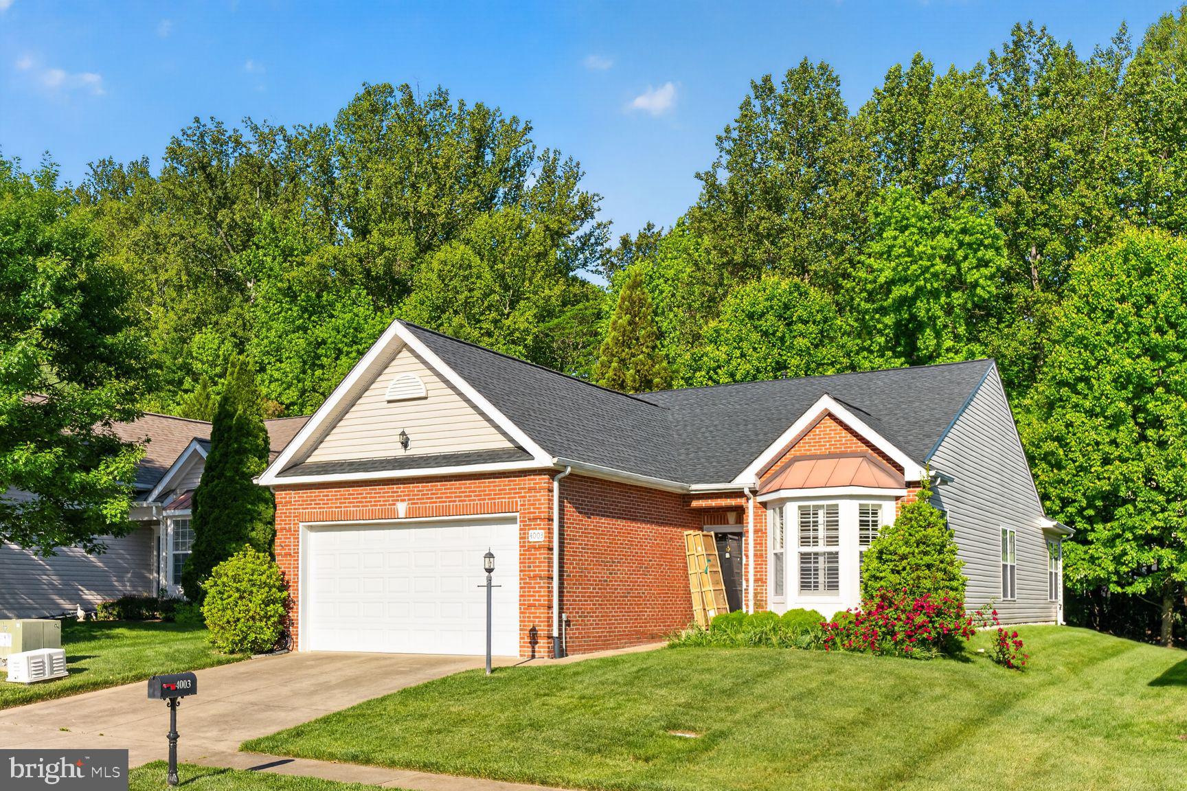 **OPEN HOUSE – Sunday, June 7 | 1:00 PM – 4:00 PM**

Welcome to this beautiful single-level home in the highly sought-after 55+ community of Four Seasons at Historic Virginia. Featuring an attractive brick-front exterior, this meticulously maintained 2-bedroom, 2-bath residence offers the perfect blend of comfort, style, and move-in-ready convenience.

Thoughtfully updated inside and out, the home boasts a private, tree-lined backyard—ideal for relaxing, entertaining, or simply enjoying peaceful outdoor living. The charming brick façade enhances the home's curb appeal and provides the look and feel of newer construction.

Inside, you'll find gleaming hardwood floors throughout the foyer, great room, sunroom, and kitchen. The updated kitchen showcases elegant quartz countertops, a stylish tile backsplash, a spacious pantry, and stainless steel appliances, including a refrigerator, dishwasher, and range. Adjacent to the kitchen, the sun-filled breakfast area offers the perfect spot to enjoy your morning coffee while taking in abundant natural light.

Fresh neutral paint throughout creates a bright, welcoming atmosphere. The spacious primary suite offers exceptional comfort and flexibility, featuring a large walk-in closet and a private en-suite bath with dual vanities. A generously sized second bedroom and a full bath with a recently refreshed shower provide comfortable accommodations for guests. Both bedrooms feature upgraded new carpeting, while premium plantation shutters throughout the home add timeless elegance and value beyond traditional blinds.

The oversized two-car garage offers high ceilings for additional storage, space for a small workshop, and convenient wall-mounted storage racks. Additional features include an underground irrigation system that helps keep the beautifully landscaped yard lush and vibrant with minimal effort.

Living in Four Seasons means enjoying an exceptional resort-style lifestyle with access to an impressive array of amenities, including indoor and outdoor swimming pools, a fitness center, clubhouse, pickleball courts, a putting green, ballroom, and a full calendar of social activities. This vibrant community is known for its welcoming atmosphere, beautifully maintained grounds, and active lifestyle opportunities.

With wonderful neighbors, manicured landscaping, desirable one-level living, and outstanding community amenities, this exceptional home offers everything you need for comfortable, carefree living. Don't miss this opportunity to make it yours!