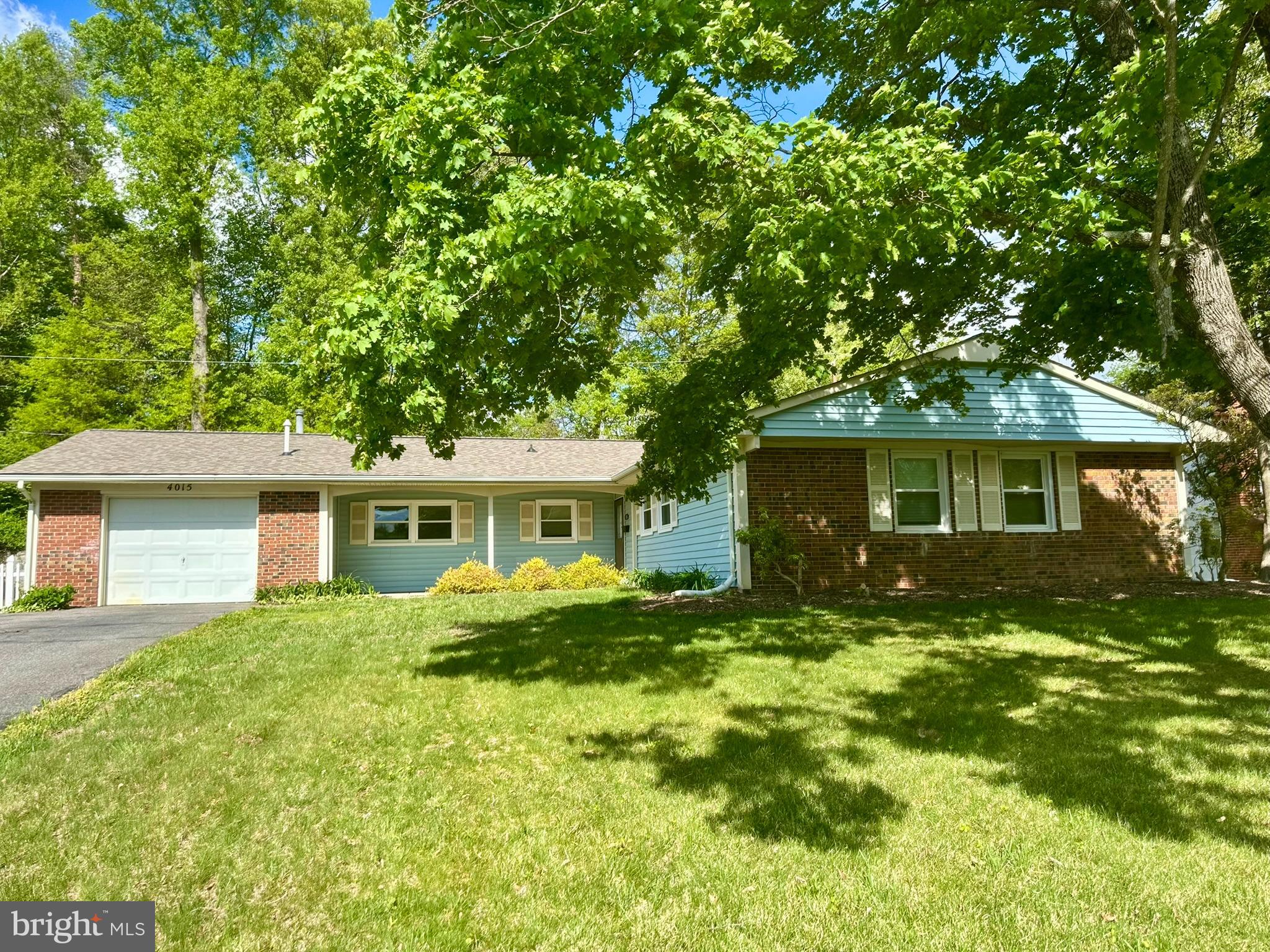 Welcome home to this Devon rancher with 1,849 square feet of living space on one level. Part of the original living room has been converted to a fourth bedroom with a built-in desk. The foyer entry has ceramic tile and two large closets. The living room/dining room combination has room for a formal dining table and has great natural light. There are gleaming hardwood floors and ceiling fans throughout the home. The kitchen has ceramic tile, stainless steel appliances, a french door refrigerator with lower drawer freezer, a solid surface induction cooktop, a built-in microwave and a wall oven. The thoughtful Landlords have included a set of magnetic cookware to use with the induction cooktop. The kitchen has table space and a sliding door for great entertaining flow to the rear patio and yard. The family room is open and adjacent to the kitchen, has a wood burning fireplace, mantle and built-in shelves. The main level laundry room is adjacent to the family room and the garage and has lots of shelving and a rear exit door for convenient access to the yard.  The hallway to the bedrooms has a convenient full bathroom with tub and shower, a large linen closet, second coat or storage closet and three more bedrooms with hardwood floors and ceiling fans. The primary bedroom has a private bathroom with ceramic tile and stand-up shower. The rear space has two tiers of yard space to enjoy, a stamped concrete patio, a new retaining wall and concrete steps that lead to the upper yard. There is a shed for more storage and three seasons of lovely landscaping. There is an oversized one car garage with a newer garage door and the driveway has parking for 5+ vehicles plus a side driveway apron for a RV, boat or more cars. All this is close to commuter routes, gourmet restaurants, great shopping, coffee shops and so much more. Visit the City of Bowie website to see all that Bowie has to offer. There is a $50 application fee for each tenant over the age of 18 and $100 for a married couple. Rental Qualification Formula: Take gross yearly income and divide by 12. Multiply that amount by 60%, then subtract rent and any debt (e.g. revolving credit, car payments, daycare and etc.) from above amount. There must be at least $300 left over when you get the final amount. Minimum of 650 credit score required. No smokers or pets will be accepted.