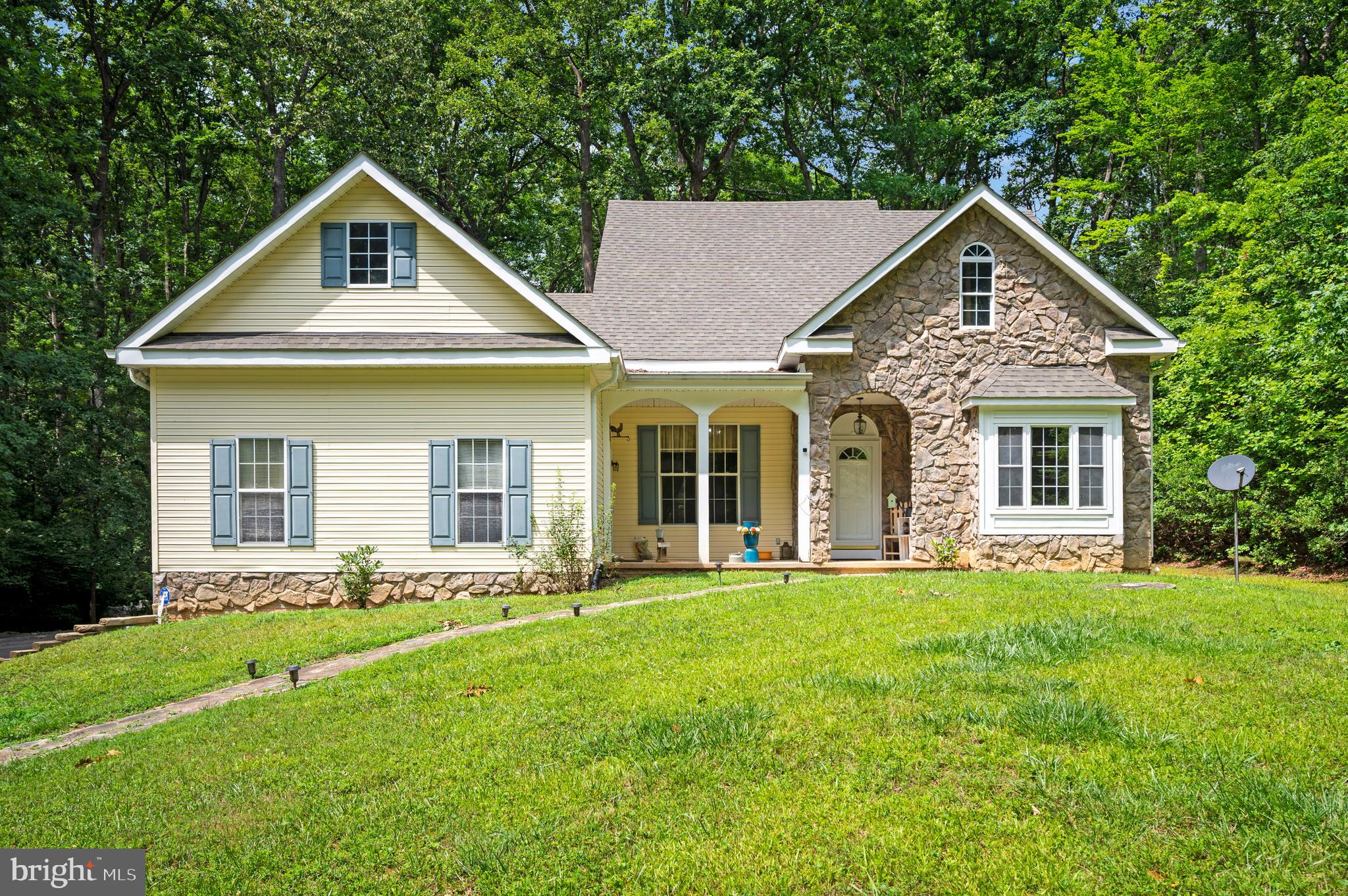 Welcome home to 319 Richland Road, where spacious living and thoughtful design come together in a beautiful setting. The heart of the home features a well-appointed kitchen with warm oak cabinetry, a five-burner range with built-in griddle and air fryer, a double sink, and durable tile flooring. Perfect for everyday living and entertaining.

***Multiple living spaces provide flexibility for every lifestyle. Relax and gather by the cozy corner fireplace in the impressive family room with soaring cathedral ceilings. Just off the family room is the stunning four-season sunroom, sure to impress with approximately 20-foot vaulted ceilings, a dramatic rock accent wall, lower picture windows that bring the outdoors in, and direct access to the primary suite.

***The screened-in porch on the left side of the home offers the perfect place to enjoy your morning coffee or unwind in the evenings while overlooking the outdoors from the solid wood porch swing.

***The spacious primary bedroom features updated luxury vinyl plank flooring and a spa-inspired ensuite bath complete with double vanities, a large corner jetted soaking tub with its own dedicated water heater, a separate shower, private water closet, and a generous walk-in closet.

***A versatile flex room with a charming window seat can easily serve as a formal dining room, home office, library, or study. Two additional bedrooms feature hardwood flooring, with Bedrooms 2 and 3 connected by a convenient Jack-and-Jill bathroom. Bedroom 3 also includes a double closet.

***Additional highlights include a laundry room with utility sink, a garage workshop for hobbies or storage, and 9-foot ceilings throughout much of the home, creating an open and airy feel in every space.