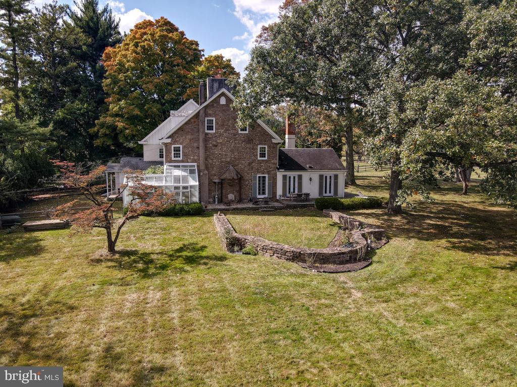 Uniquely charming, the Westside farm includes the original Westside farmhouse adjacent to historic Dawesfield, once home to Robert Morris, signer of the Declaration of Independence.  Lewis Lane courses through largely preserved open space on a leafy country lane in the center of historic Whitpain. Five acres of sweeping lawn secures privacy and will  easily allow space for a new addition or a completely new home and subdivision possibilities are indicated.

If you love history and a home oozing character, this opportunity does not come often. A newer kitchen addition with expansive glass allows for immediate possession and move-in.  Come and tour the  original wood floor spaces with architectural character in all sight lines. The floor plan includes five bedrooms, five full baths and a powder room.  A living room, and sitting room with an old world cooking fireplace connect to a dining room and entry hall.