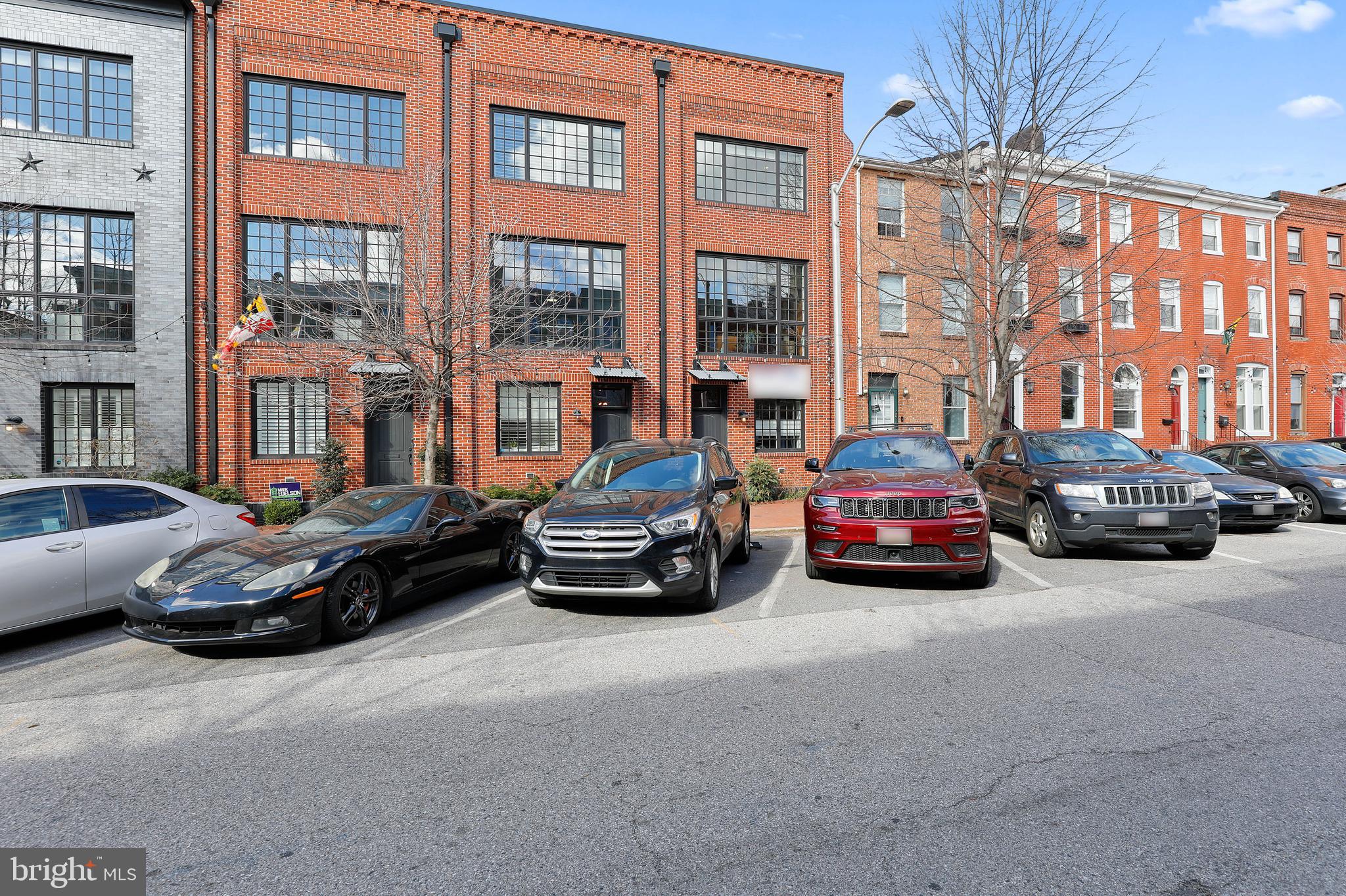 IMMACULATE 4 STORY HOME LOCATED IN UPPER FELLS POINT ON SOUGHT AFTER BLOCK WITH 2 CAR GARAGE PARKING! OVER 2,400+ SQUARE FEET. GLISTENING FINISHED IN PLACE OAK HARDWOODS CASCADE THROUGHOUT. ENJOY CUSTOM CABINETRY, UPGRADED TRIM, IMPORTED TILE,  GRANITE COUNTERTOPS, DESIGNER LIGHTING, SS GE MONOGRAM APPLIANCES PACKAGE IN STUNNING CHEF'S KITCHEN WITH UPGRADED WINE FRIDGE. TONS OF NATURAL LIGHT. HIGH CEILINGS. TONS OF STORAGE. WALK-IN SHOWERS. WALK-IN CLOSETS. CUSTOM DUMBWAITER. SPACIOUS 3 BEDROOMS WITH 3 FULL BATHS INCLUDING MASTER SUITE WITH FRAMELESS GLASS SHOWERS. SECONDARY GREAT ROOM ON 4TH LEVEL - GREAT FOR FAMILY ROOM, HOME OFFICE, OR HOME GYM. EXPANSIVE TREX DECK FOR ENTERTAINING WITH AMAZING CITY AND WATER VIEWS. CLOSE PROXIMITY TO RETAIL SHOPPING, LOCAL DINING, PATTERSON PARK, FELLS POINT, HARBOR EAST, AND ALL MAJOR HIGHWAYS. SCHEDULE A PRIVATE TOUR TODAY!