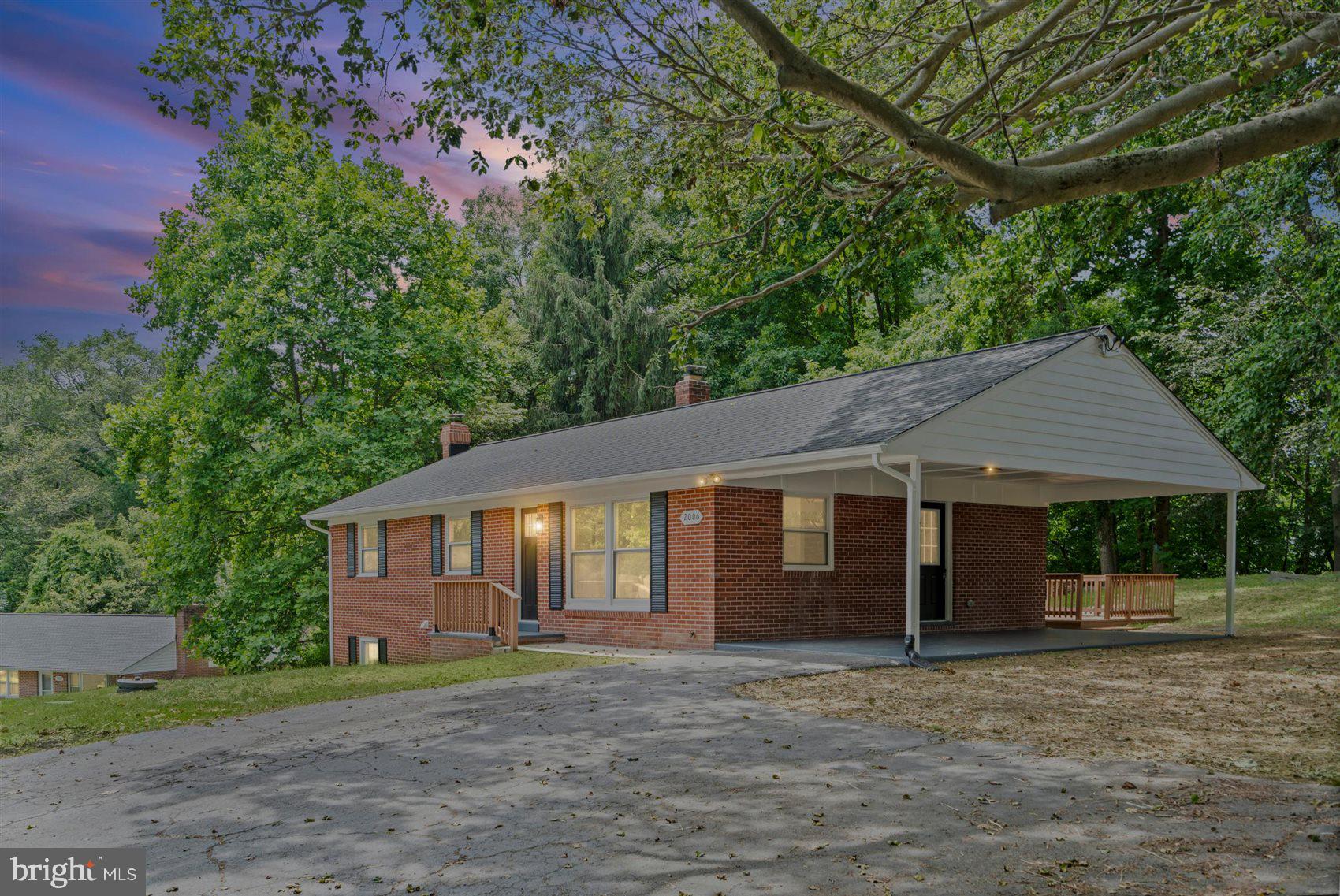 Beautifully renovated rancher featuring a bright, open floor plan and high-end modern finishes throughout. The main level includes a gourmet kitchen with a massive center island, quartz countertops, stainless steel gas appliances, and three bedrooms with two beautifully updated full baths. The huge, fully finished lower level offers a sprawling recreation room with new carpeting and extensive storage space. Upgraded with custom recessed lighting, new flooring, and updated fixtures across both levels. Exterior features include a large, elevated rear deck perfect for entertaining and a custom built-in stone fire pit area in a private backyard that backs beautifully to mature trees. Move-in ready and perfectly designed for modern living.