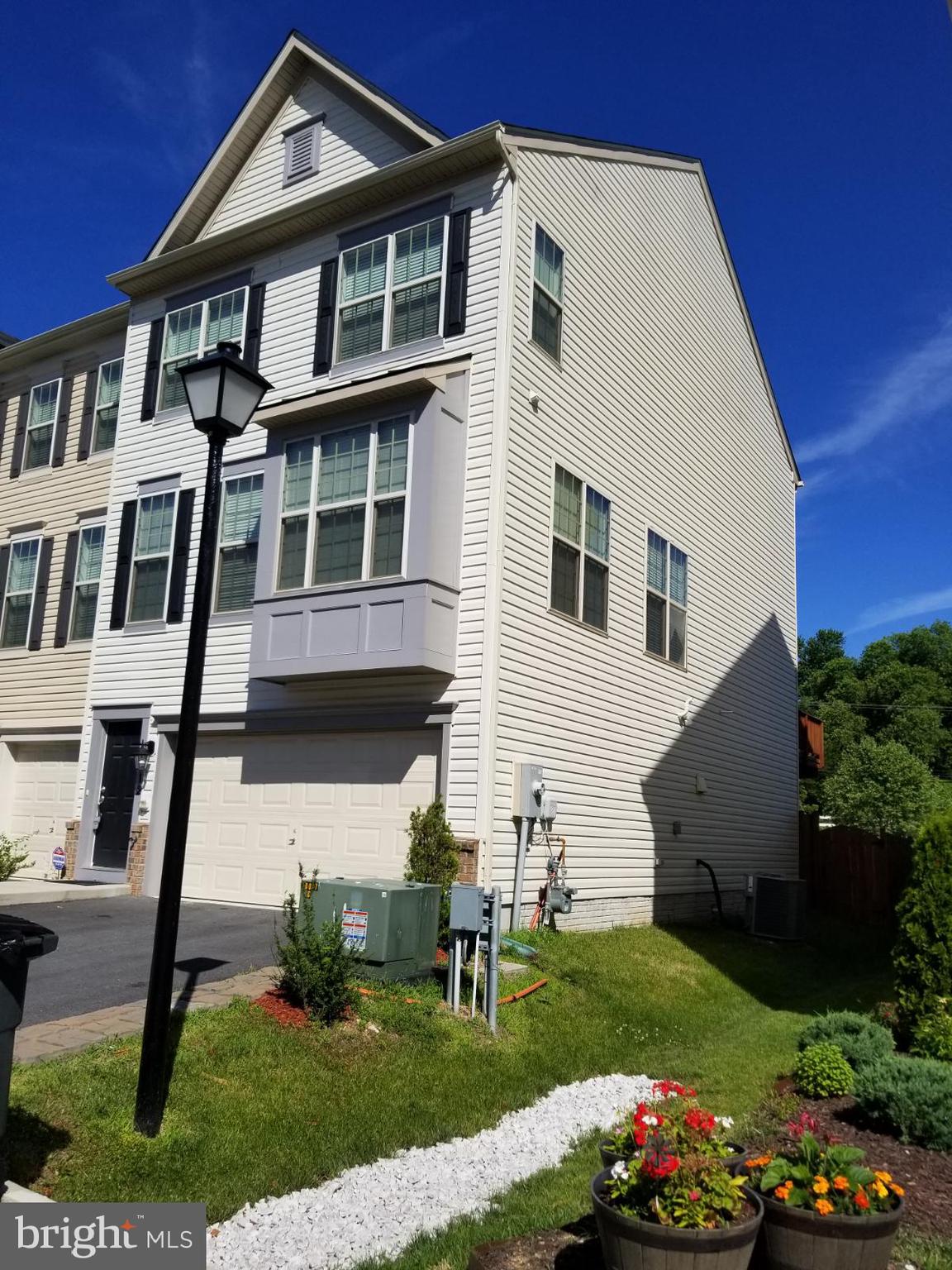 Almost new end unit with two car garage. Only a few in the neighborhood. Close to Ft Meade. Large deck and fenced yard. Open floor plan with with lots of windows and light. Bathroom on every level. Gourmet kitchen with  hardwood floors gas stove and updated counters and cabinets.