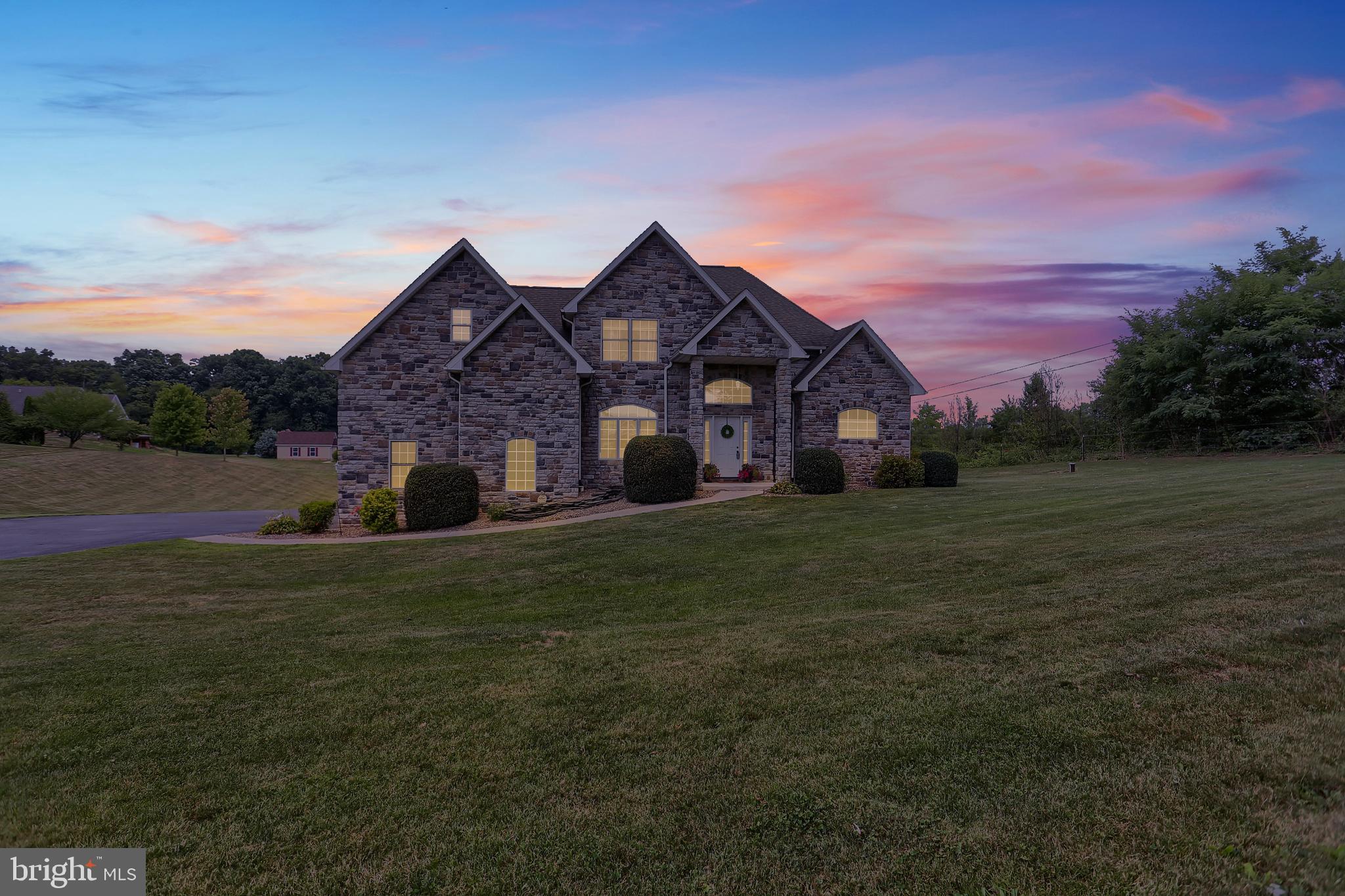 Well appointed, IMPRESSIVE  home!   This contemporary beauty sits on a peaceful, manageable landscape of  1.37 acres.    1st floor master suite w dual closets and bath with whirlpool tub.  Family room with vaulted ceiling,  built-ins flank the gas propane fireplace and sliding door lead to the spacious deck with stairs to the back yard.  Updated kitchen, quartz counter tops, tile backslash, stainless steel appliances and island/breakfast bar is sure to please.  Custom sliding barn door leads to laundry/mud room.   Foyer and Dining room have hardwood flooring.  Home offer plenty of closets and great natural light.  3 bedrooms and a full bath complete the 2nd floor.   Full unfinished basement with walk out to back yard.  This lovely Home is adjacent to PA/MD line, convenient to I-81,  Greencastle address, Tuscarora School District.