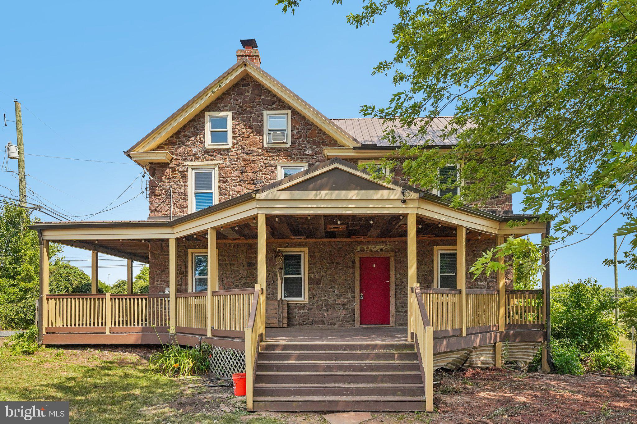 Own a piece of history on nearly 1.5 acres in the award winning Spring-Ford Area School District. This circa 1830 stone farmhouse has been thoughtfully updated while preserving the character that sets it apart: exposed stone walls, original hardwood floors, and beamed ceilings throughout. The heart of the home is a renovated kitchen with a large center island, granite counters, stainless steel appliances, farmhouse sink, and a sliding barn door pantry. Gather in the sunlit living and dining rooms framed by natural stone, with a convenient half bath completing the main level. Upstairs, you will find four bedrooms and a beautifully redone full bath with a double vanity. Outside, a classic wraparound porch overlooks open, level grounds with plenty of room to garden, play, and expand. All just minutes to Route 422, Limerick Community Park, shopping, and dining, with an easy commute to King of Prussia and Philadelphia. Historic soul, modern comfort, and land to grow into. Don't wait to see this one.
