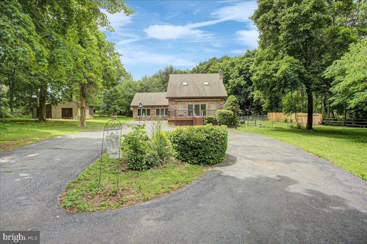Welcome to this spacious 3-bedroom, 3-bathroom Cape Cod offering 2,442 square feet of living space on 2.58 acres in Fayetteville. Conveniently located near Conocodell Golf Course and just a short drive to shopping, dining, and everyday amenities, this property offers a great balance of accessibility and privacy.

Inside, you’ll find a flexible layout featuring a primary bedroom on the main level with a walk-in closet, as well as an additional primary bedroom on the upper level. The home also offers a third bedroom, three full bathrooms, plenty of closet space, two fireplaces, and an extra storage room with its own side entrance.

Outside, enjoy the peaceful setting from the included hot tub or relax on the front porch under the motorized retractable awning. A large shed provides additional outdoor storage, and the 2.58-acre lot gives you room to spread out, entertain, or simply enjoy a more private setting. This property offers plenty of potential both inside and out.

Drone footage coming soon!