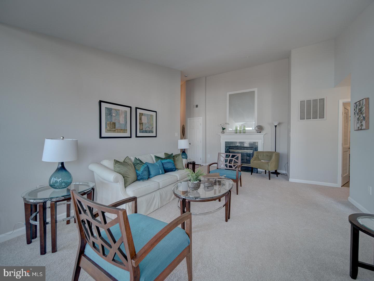Beautifully updated penthouse unit in secure building.  Gorgeous new kitchen with quartz counters and LVP floor.  Fresh paint and new carpet throughout,  new LVP floors in kitchen and primary bath, new HVAC, water heater new in 2023, new lighting and hardware in both baths and throughout unit, wood floors, fireplace, vaulted ceilings, split floor plan, washer/dryer in unit.  Move-in ready spacious unit.  This home is as close to perfect as one  can get.  Check out the competition; nothing exceeds the updates and finishes.  Close to major roads, Ft. Belvoir, metro, shops and restaurants.  Bus service to metro.  Now that the snow is cleared and the temps are warming up, come on by and see for yourself the care and attention that went into this lovely model.