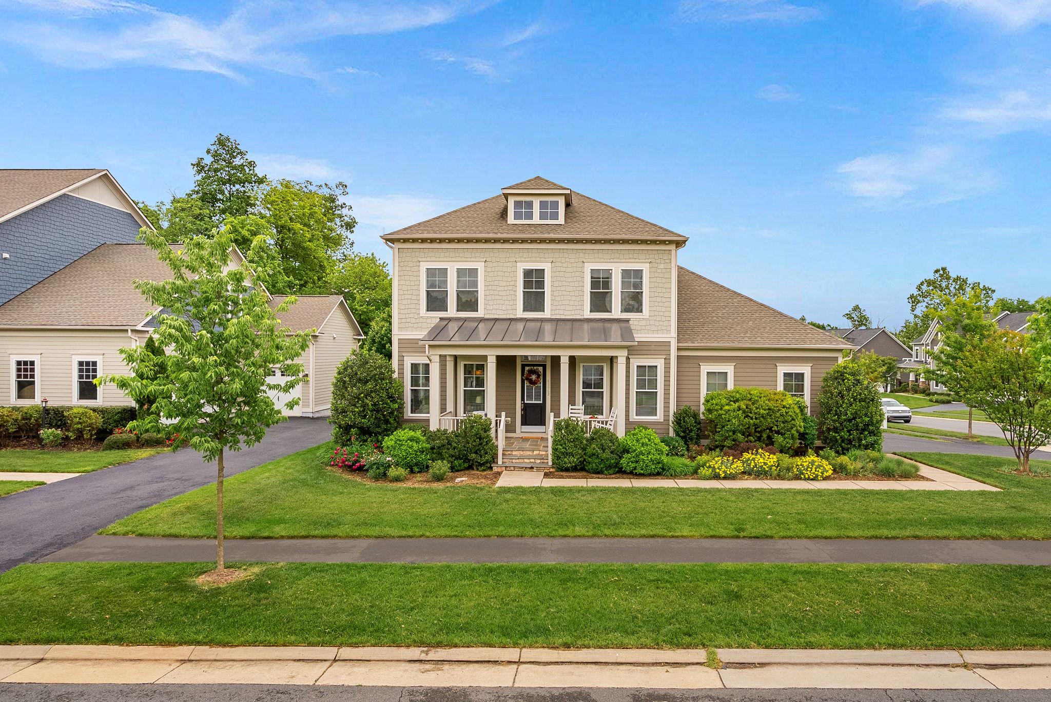 This like new K Hovnanian Craftsman home will have you settling in just in time for summer. With over $130,000 in updates, it's not just a home- it's a lifestyle upgrade! Situated in Willowsford on a premium corner lot backing to conservancy, this one checks all the boxes. One of the rare corner lots that's spacious enough for a 3 car garage. No driveway shuffle! You will feel right at home from the moment you pull up to this beautifully landscaped property. Bonus, this home is tucked inside the community with no through traffic so you can actually enjoy sitting on the front porch and chatting with neighbors.  

Notable updates include: Remodeled powder room, Bosch dishwasher, Zephar Hood, Refrigerator, Tile Backsplash, Hardwood flooring, new upper level carpeting, new garage doors, Built-Ins, Professionally designed landscape and outdoor space, fully fenced yard, buried downspouts and sump pump drain, attic fans in main and garage roof, buried drains, garage floor with epoxy flooring, and so much more!

You will love the timeless style, sun filled spaces, and the kind of everyday functionality that makes life run smoother. Designer lighting, hardwood flooring, custom built-ins, new carpeting and fresh paint make this home move in ready so you don't have the stress of a to-do-list. Inside, expansive living areas are filled with natural light and designed for the way people truly live - open gathering spaces, flexible rooms for work or play, and seamless indoor-outdoor flow. The chef’s kitchen serves as the centerpiece of the home, featuring an oversized island, double oven and hood, premium finishes, abundant cabinetry, and space to entertain, whether hosting holiday dinners or casual evenings with friends. The family room features custom built-ins, a fireplace and a rear bump out that offers plenty of space for family movie night or retreating with your favorite book. There is a home office on the main level that is great for work from home days or to use as a flex space. 

Upstairs, the spacious primary suite feels like a private retreat with a spa-inspired bath and generous walk-in closets, while the additional bedrooms offer comfort and versatility for family, guests, or multigenerational living. Don't miss the walk-in closets and generously sized secondary rooms. An upstairs laundry room with built in cabinets is the ultimate in convenience and functionality. The finished lower level expands the home even further with recreation space, guest suite with walk-in closet and full bath, and an additional unfinished space to create the lifestyle you want.

Outside, enjoy peaceful mornings, evening barbeques, sunset views, and the beautiful street scape that makes Willowsford one of Northern Virginia’s most coveted communities. This home features a professionally designed outdoor space with both a composite deck and oversized patio with fire pit, making it the perfect space to hang out with family and friends. There is even a fully fenced yard adding convenience and privacy. The garden is the perfect spot to decompress after a long week. 

Residents enjoy resort-style amenities including pools, fitness center, farm-to-table lifestyle programming, miles of scenic trails, parks, playgrounds, community events, and access to highly rated Loudoun County schools. This community is truly unique offering something for nature enthusiasts and 5 star resort lovers alike. Perfectly positioned near Ashburn’s dining, shopping, commuter routes, and everyday conveniences, this is more than a home - it’s a lifestyle opportunity that will truly level up your day to day living.