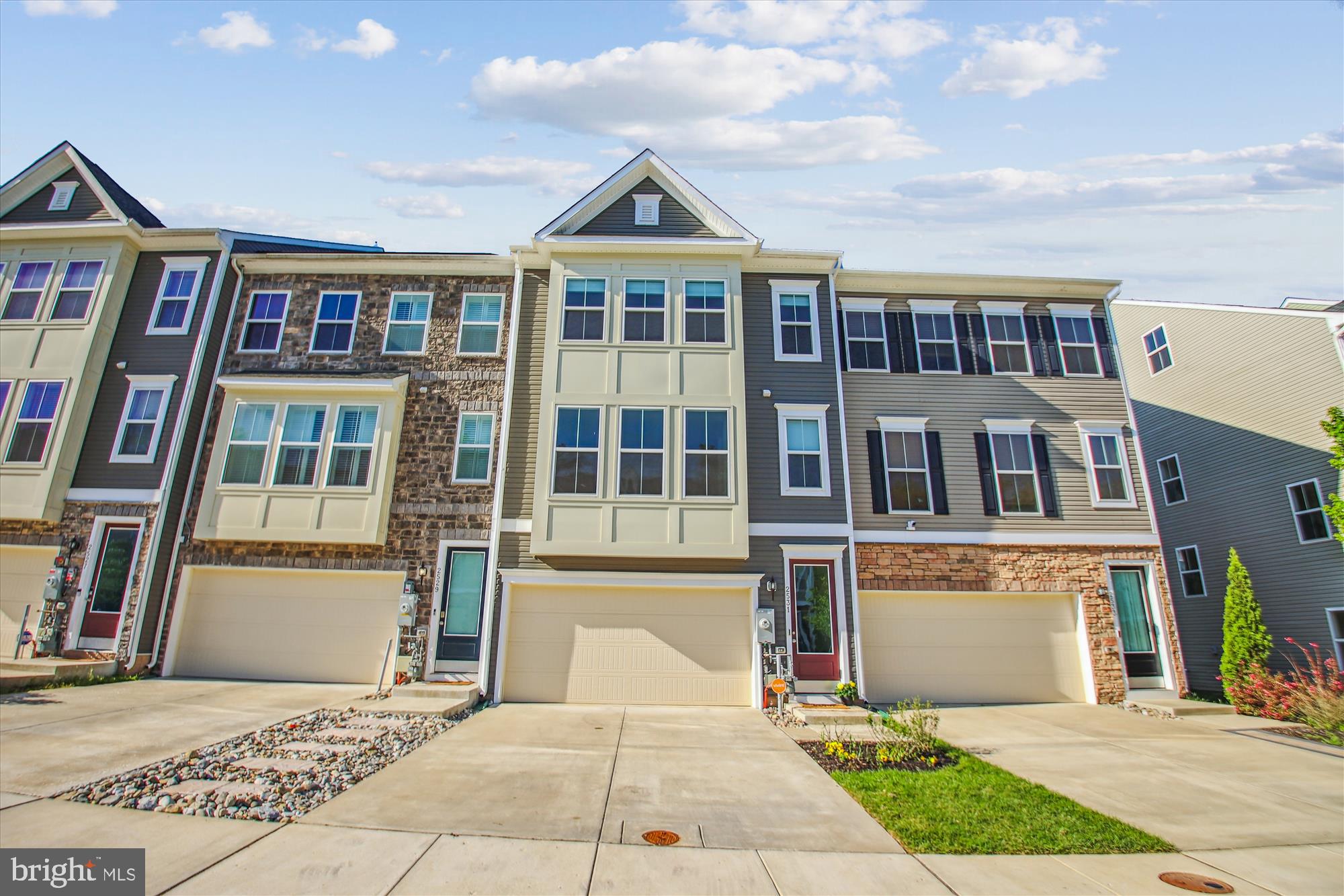 ***Offer deadline for this Sunday, 5/4/25, at 8am***Welcome to this stunning luxury townhome in the highly sought-after Enclave at Waugh Chapel. This spacious 4-level residence offers 5 bedrooms, 3.5 bathrooms, a 2-car garage, and an expansive rooftop deck—perfect for modern living and entertaining. Brand new carpeting has just been installed for a fresh, move-in-ready feel. The home showcases an open-concept layout featuring a gourmet kitchen with a large center island, gas cooktop, double ovens, quartz countertops, stainless steel appliances, and two pantries. Adjacent to the kitchen, step out onto the private deck—ideal for outdoor dining or morning coffee. This level also includes a dining area, a sunroom flooded with natural light, and a convenient powder room. Upstairs on the third level, the primary suite offers a serene retreat with dual walk-in closets and a spa-inspired en-suite bath, complete with dual vanities and a walk-in shower. Two additional bedrooms, a full bathroom with a tub/shower combo, and a laundry room complete this floor. The fourth level offers a flexible space that can serve as a bedroom, home office, or media room, featuring a large walk-in closet and direct access to the rooftop deck—perfect for entertaining or enjoying peaceful sunsets. The entry-level includes a multi-purpose room that can function as a fifth bedroom, guest suite, or bonus room, complete with its own walk-in closet and a private full bath with shower. Residents enjoy access to community amenities including a tot lot and dog park, and are within walking distance to  Wegmans, Target, and multiple restaurants in the Waugh Chapel Towne Centre.