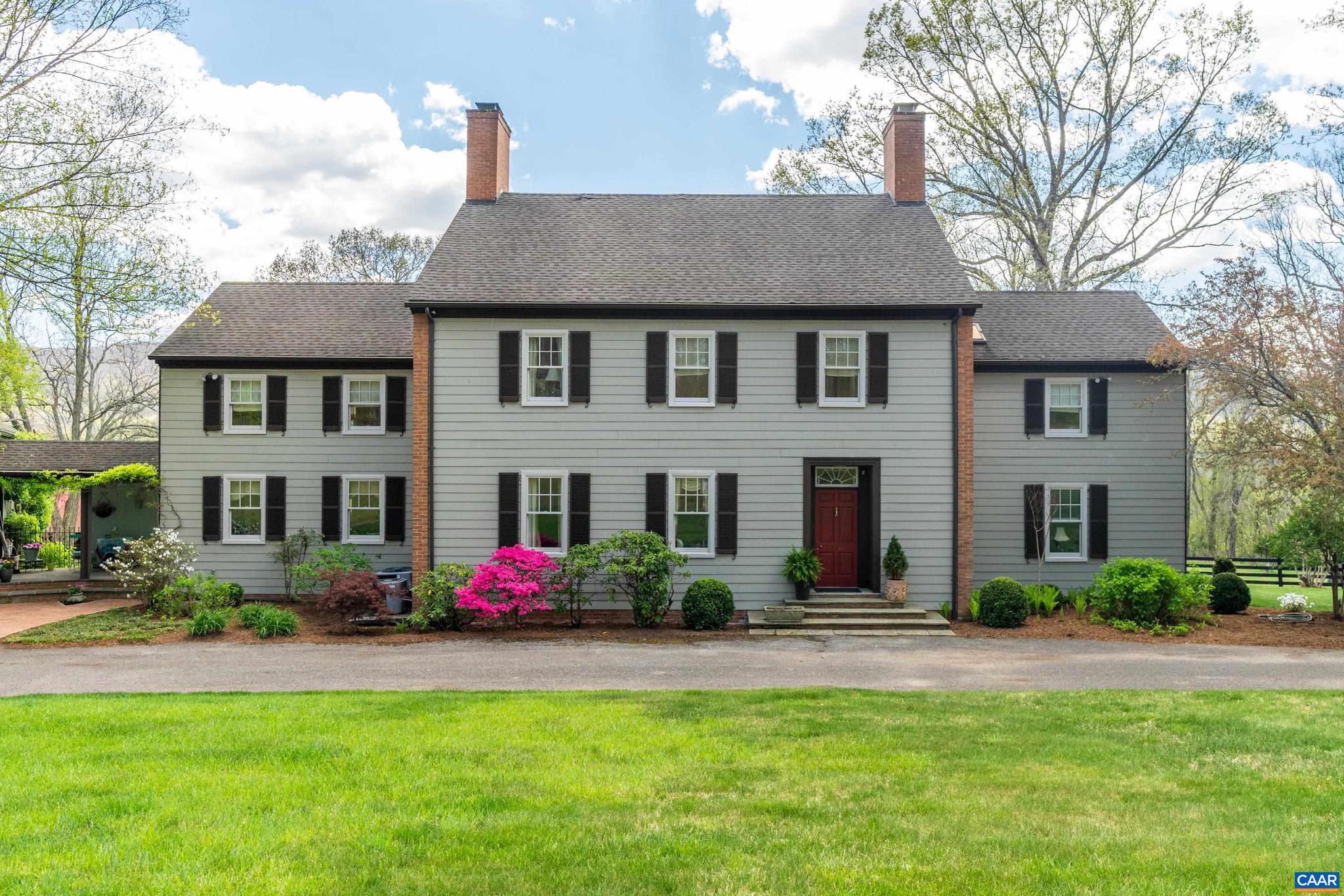 Designed by Virginia architect Thomas W. S. Craven and set on 65.73� private acres in the mountains of Hot Springs, this five-bedroom farmhouse estate is offered for the first time in a generation. Just 10 miles from the Omni Homestead Resort, the setting is as private as it is well-positioned. The main house (5 BR / 3.5 BA) reflects Craven?s attention to finish and proportion: Venetian plaster walls, crown moldings, soaring 20-foot ceilings in the upstairs primary suite, and two fireplaces anchoring the entertaining rooms. A renovated kitchen opens to a morning room with mountain views. A screened porch, slate breezeway, and formal rear gardens complete a home that lives well in every season. The first-floor primary suite offers screened-porch access and a full bath. Upstairs, a second primary retreat features 20-foot ceilings, a dressing area, two walk-ins, and a private bath. Three additional bedrooms and a corner study round out the upper floor. Above the attached garage, a self-contained apartment with one bedroom, kitchenette, and full bath offers flexible accommodations for guests or staff. A four-stall barn, fenced pastures, and wooded trails complete the offering.,Granite Counter,Painted Cabinets,Wood Cabinets,Fireplace in Dining Room,Fireplace in Living Room