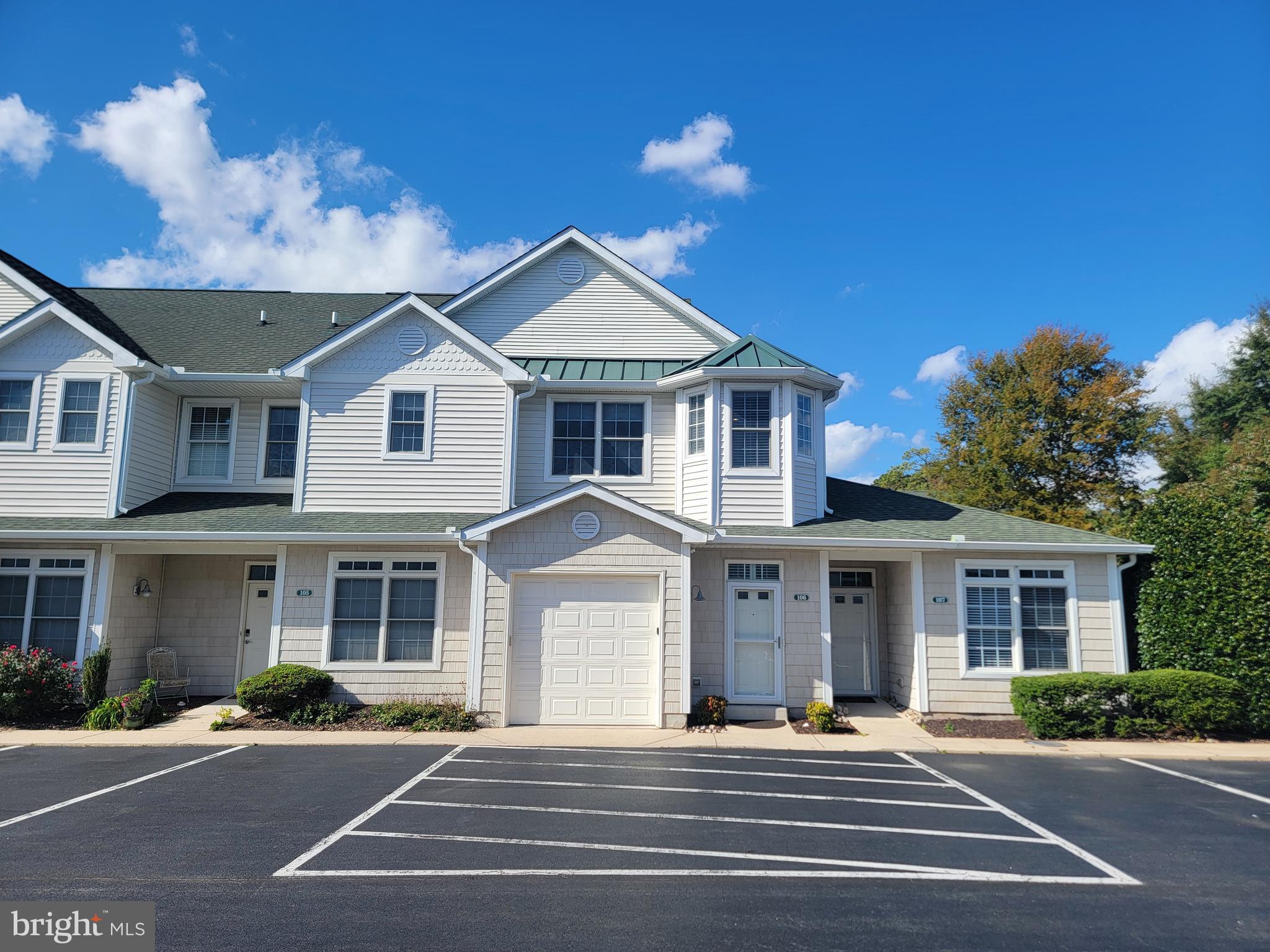GREAT LOCATION EAST OF RT 1.   Welcome to  19967 Sandy Bottom  Circle #106 in Rehoboth Beach! This pristine, 3 bedroom 2 bath condo with garage is sure to impress.  Offered completely and beautifully furnished including artwork and ALL contents.  Perfect for your own retreat or for a rental investment.  1st floor garage with electric car charging station, laundry and entry hall, The 2nd level will delight as you view the large  great room area with cathedral ceiling and recessed lighting.   Warm hardwood floors invite you into the kitchen with maple cabinets, granite countertops and stainless steel appliances.  A breakfast bar with seating makes for quick dining or guest seating while your preparing snacks and dinner.  The owner's suite with walk in closet and private bath is situated separately from the other 2 bedrooms and bath.  Beautiful newly installed patterned carpeting welcomes you to the bedrooms and stairway.  All windows are fitted with tasteful motorized shades and are newly installed.  A new HVAC system was installed recently for many years of reliable heating and cooling.  Walk or bike to the beach and boardwalk and all of the amenities of beautiful downtown Rehoboth Beach.  Don't miss this rare opportunity.