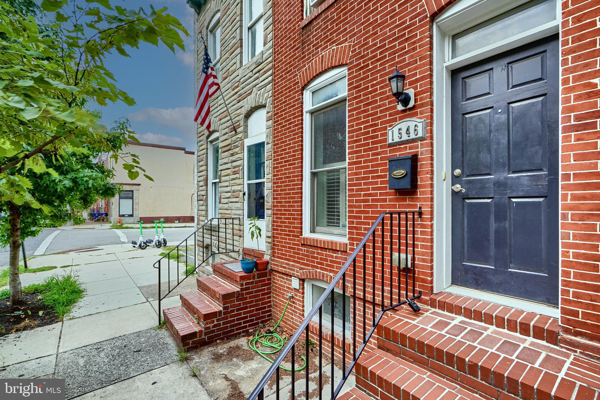 Gorgeous renovation with 2 upper bedrooms and a finished basement that could be a 3rd.  This home is everything you're looking for. 3 full baths and a powder room allow for easy access on every level. Hardwood flooring extends through the main level and shines from the abundant recess lighting. The kitchen cabinetry is a great layout with storage on 2 walls and seating at the rear peninsula. Gas cooking compliments the full stainless steel appliance package. Full size washer dryer is located in the second floor hallway for convenience as well. There is 2 car rear parking as well as a 2 tiered roof deck with stunning city skyline views. This home won't last long!
