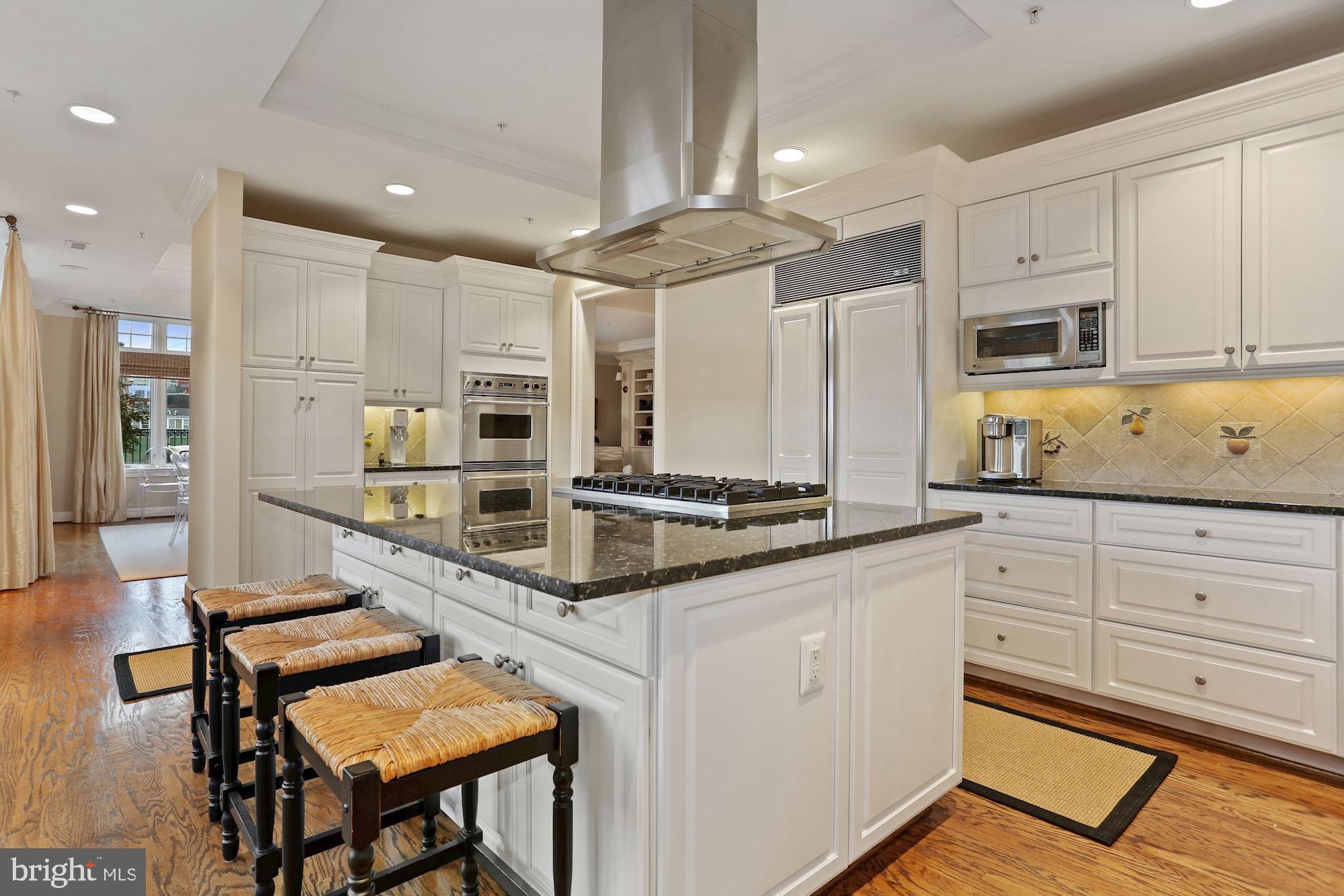 Price adjustment! Gorgeous 2,750 sq ft, 3 BR, 2.5 BA penthouse apartment with unparalleled indoor/outdoor living! This stunning apartment features an open living/ dining room with built-ins and crown moulding, a spacious kitchen with large center island that opens to a den/ family room with built-ins, powder room, two expansive terraces that are perfect for outdoor entertaining, a lovely primary bedroom suite with built-ins, walk in closet, and spa-like bathroom, two additional bedrooms, hallway full bathroom, laundry room, and ample closet storage. This apartment also includes one storage unit and three parking spots! Showings by appointment.
