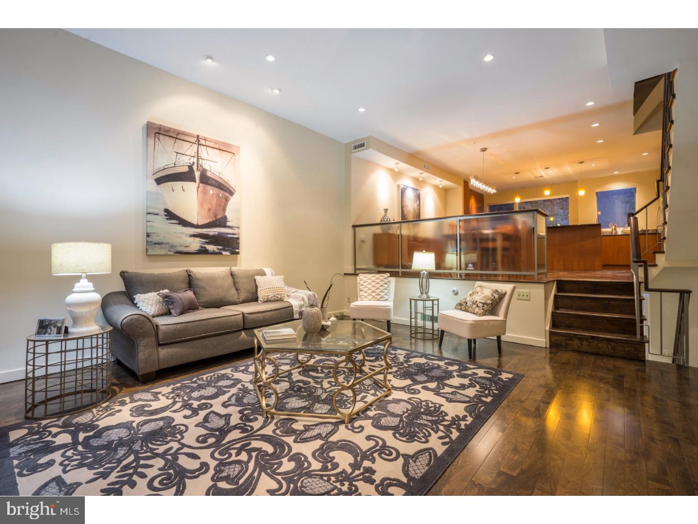 Welcome home to 1939 Pine Street! Situated in Rittenhouse Square, this stunning home provides a unique blend of historic charm with top-of-the-line modern convenience. The open layout of the main living area makes for easy entertaining, and creates the heart of this home. The living room has new radiant-heat hardwood floors, high ceilings, and one of two wood-burning fireplaces. Sliding doors lead to the flagstone patio, providing a serene retreat from the stress of everyday life. The new radiant-heat hardwood floors continue through the dining room and into the gourmet kitchen, which features custom-built wood cabinetry, stainless steel Paykel Fisher appliances, granite counters, a center island with large breakfast bar, and sweeping views of Pine Street. The second floor boasts two sizable bedrooms, and a modern hall bath with Jacuzzi soaking tub and radiant-heat tile floor. The sumptuous master suite is located on the third floor, and offers an over-sized bedroom with built-in closet system, and an elegant master bath with steam shower, double-vanity and radiant-heat marble tile floor. The roof deck provides additional outdoor space, and is the perfect location to enjoy panoramic views of the city. Back inside, the lower level is the ideal spot for a home office or fourth bedroom, as well as providing storage and inside access to the attached 1-car garage. Nestled in the heart of Rittenhouse Square, this home is mere steps from the park, dozens of famed restaurants and shops, and is located in the Greenfield catchment. This is a rare opportunity to own a truly one-of-a-kind property, so schedule your showing of 1939 Pine Street today!