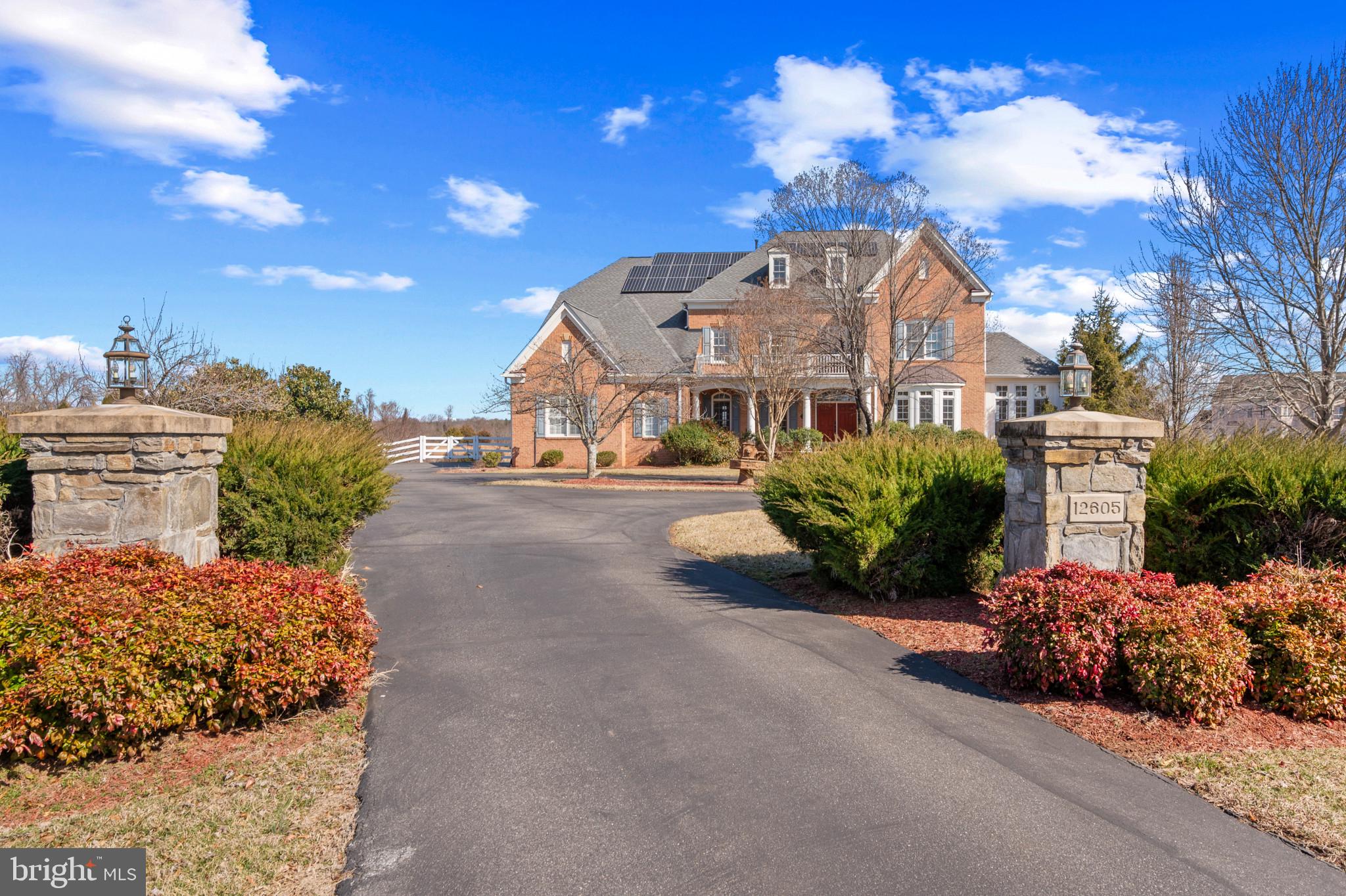 Welcome to 12605 Hill Creek Lane, an elegant retreat in one of Potomac's most prestigious neighborhoods. Situated on a serene 2-acre lot, this stately 6-bedroom, 6.5-bathroom all-brick home offers over 9,000 square feet of meticulously designed living space. As an original-owner property, it has been thoughtfully maintained and upgraded to provide exceptional comfort and functionality. 
• Four-Zone HVAC: Ensuring personalized comfort throughout the home.
• Energy Efficiency: Owned solar panels and a whole-house generator for reliable energy solutions
• Infrastructure: Well and septic system, with additional tanks to support the house sprinkler system
• Convenient Parking: Asphalt circular driveway with a centerpiece, accommodating up to 15 cars
• Security & Comfort: Video cameras, NEST system, sound system throughout the house, and heated doghouse.
• Fully Fenced Grounds: Brick columns with lights at the entrance frame the gated property
• Whole house freshly painted
• New carpet throughout the house
• New lighting throughout the house

From the moment you step into the grand two-story foyer, you are greeted with an ambiance of sophistication and warmth. The open floor plan seamlessly connects the formal living and dining rooms, adorned with custom millwork and oversized windows that flood the home with natural light. The spacious family room, featuring a cozy fireplace, flows effortlessly into the gourmet chef's kitchen, complete with high-end appliances, granite countertops, and a large center island—perfect for entertaining and casual dining. Adjacent to the kitchen, you’ll find a bright and airy morning room offering tranquil views of the beautifully landscaped grounds. The sunroom, situated adjacent to the living room, offers a warm and inviting retreat perfect for unwinding. Let your creativity take over—transform it into a serene music lounge, a vibrant indoor garden, or a tranquil reading nook. The possibilities are endless!
The home features two sets of staircases for added convenience. The main staircase provides elegant access to the upper level, while a secondary staircase, located off the kitchen, offers a more private route upstairs and can be equipped with a chair lift if need be.
The upper level boasts a luxurious primary suite that serves as a true retreat. Enjoy the spa inspired ensuite bath, separate walk-in closets, and a private sitting area. The luxurious primary bathroom is complemented by a soaking tub, a spacious walk-in shower, and dual vanities, providing a private sanctuary within the home. It offers ultimate privacy and convenience, featuring two completely private toilet rooms, each enclosed separately for maximum discretion. 
Step through French doors to your exclusive private balcony, where you can savor morning coffee or relax with a sunset view overlooking the tranquil grounds. Four additional generously sized bedrooms, each with its own ensuite bath, provide ample space for family and guests.
The walkout lower level is an entertainer’s dream, featuring a sprawling recreation area, a bar with a gas line, a wine cooler, a dishwasher, a home theater, and an additional bedroom/office with a full bath. Step outside to your private outdoor oasis featuring a stone patio, lush landscaping, and space for a future pool and/or tennis court.
Located just minutes from top-rated schools, fine dining, shopping, and commuter routes, this home blends luxury, comfort, and convenience. Don’t miss the opportunity to own this extraordinary property in one of Maryland's most sought-after locations.
Schedule your private tour today and experience the best of Potomac living!
