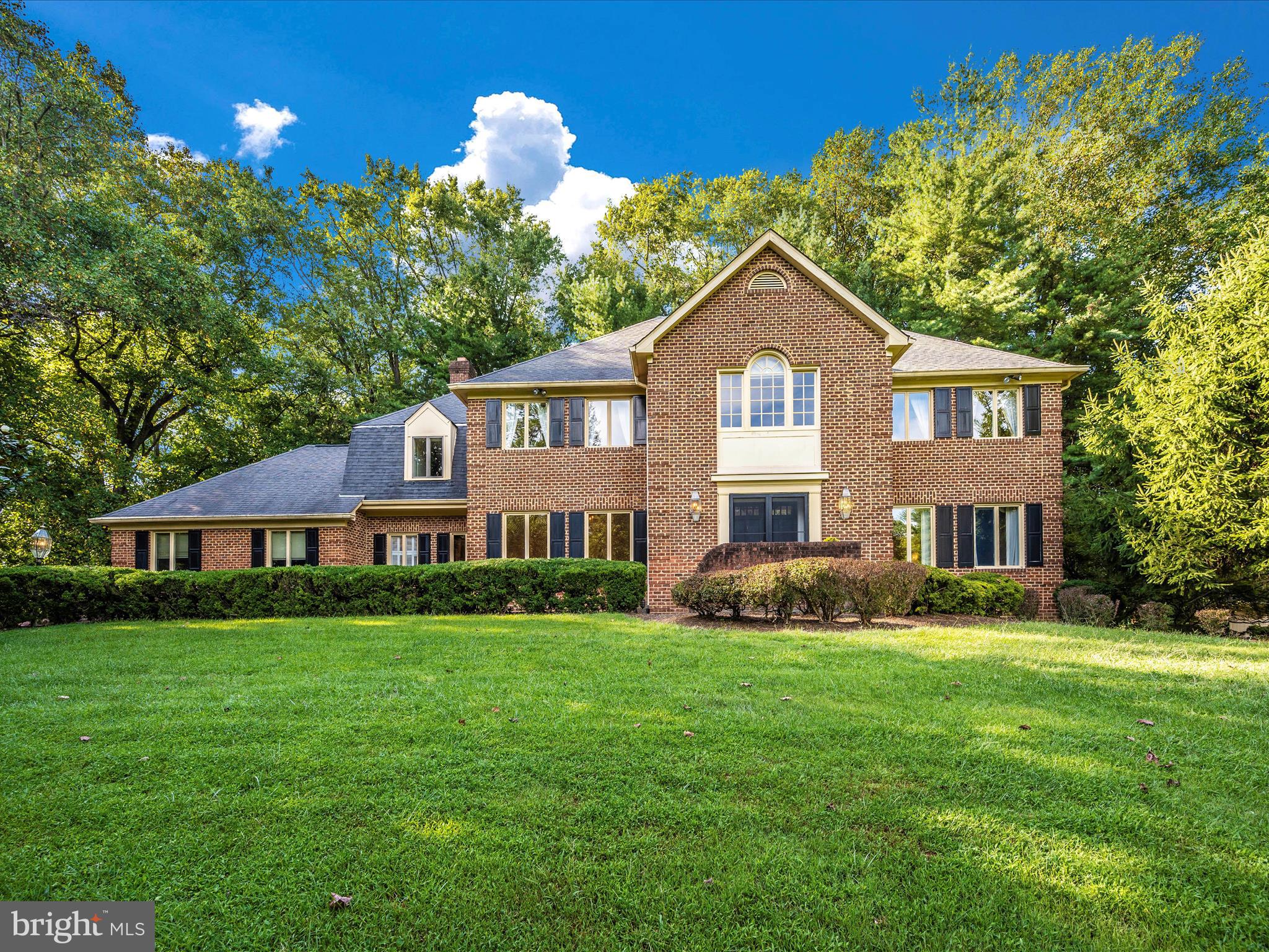 **Back on the market after being Freshly Painted on all levels! Seller, with an acceptable offer, will CREDIT Buyer $25,000.00 at Settlement towards updating the kitchen! 
This stately center hall colonial in Potomac is ready to welcome you home! Nestled on a tranquil & private 2.43-acre lot in the heart of the Lake Potomac Subdivision, this property's gorgeously landscaped yard ushers you right in!  Enjoy that retreat-like feeling while being so close to everything that Potomac has to offer! As you walk in the front door, the inviting foyer opens to a half bath, stunning private office, and a spacious living room leading to a large and elegant formal dining room. From there, enter the vast kitchen with space for a large table to be added! You'll be impressed at the beautiful woodwork and hardwood floors that adorn this main level, especially when you walk into the incredible family room! Entertain around the large wood burning fireplace or cuddle up and enjoy the built-in bar area with your beverage of choice! Walk out to the sunroom with its brick floor, skylights and breathtaking view of the yard, patio and deck leading to the huge pool area. Upstairs, the beautiful hardwood floors continue, leading to 5 large bedrooms with 3 full bathrooms! The primary suite is a dream with plenty of closets to choose from, a large double vanity and private soaking tub & shower.  Access the private bonus area over the foyer from the primary suite too! The basement level has a sliding door leading to the pool deck, along with a full bathroom and plenty of storage! The basement also has two cedar closets, a wine closet and a large safe that conveys! Outback, enjoy your own private escape or entertain like never before - you'll have the space! Multiple levels of decking means that there's room for everyone to enjoy it! The brand-new driveway leads up and around to a side-loading, oversized, two car garage and plenty of room to park in the driveway. This gem is an estate sale with the pool and outbuildings conveying as-is. Don't miss your opportunity to call this home & make this beautiful estate shine!